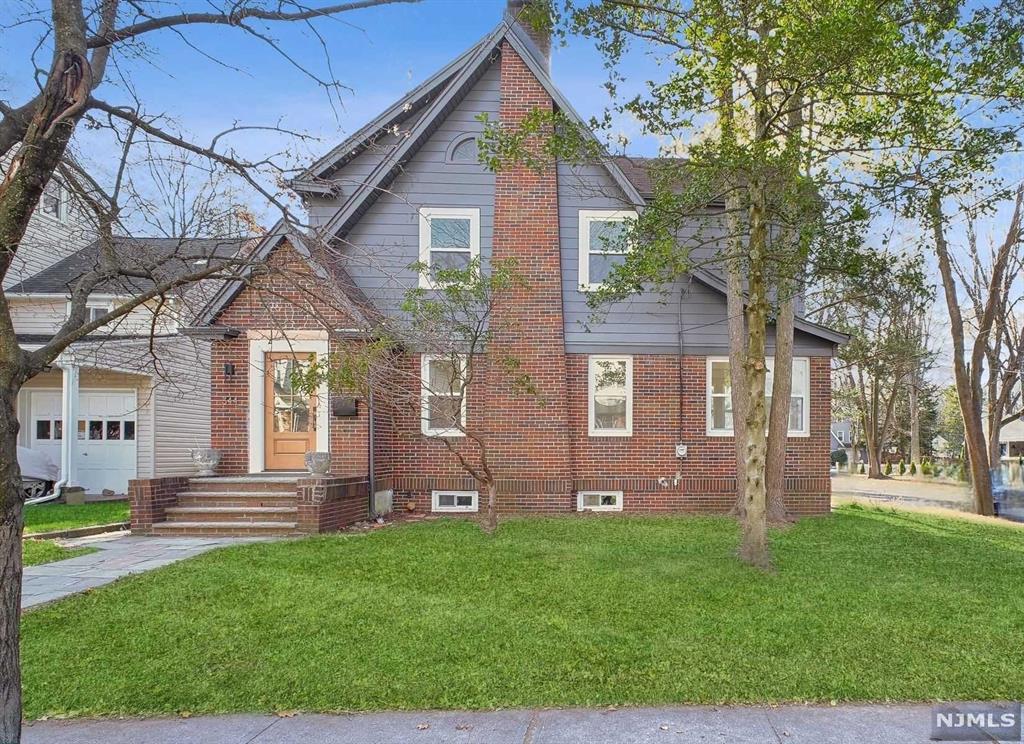 Welcome to this fully renovated three-bedroom side hall colonial in the desirable Manor section of Englewood. This charming home blends timeless character with modern amenities, offering a spacious living room and formal dining area perfect for entertaining. The updated kitchen seamlessly complements the home's inviting flow. Upstairs, you'll find three generously sized bedrooms and a beautifully updated full bath. The finished attic is ideal for a home office or play area, while the full basement, complete with a half bath and laundry room, offers additional flex space. With its prime location near parks, schools, and downtown Englewood's vibrant shops and dining, this home is the perfect blend of comfort and convenience.