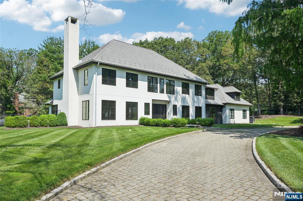 Set on 2 private acres in the sought-after enclave of Saddle River, NJ, this meticulously designed residence embodies a refined yet inviting approach to contemporary living. Built in 2018, it embodies elegance, durability & modern comfort. White oak floors, shadow reveal detailing, Duravit, & Boffi fittings establish a sophisticated aesthetic, while stone bathrooms & custom closets elevate functionality. All 5 bedrooms are en-suite; a bespoke chefâ€™s kitchen has premium appliances, & the lower level features a recreation space, bar, & gym. Technology & comfort converge seamlessly, w/Crestron-controlled blinds & security, Sonos-integrated AV, & high-speed WIFI extending across the property. The saltwater pool w/cabana w/full bath, kitchenette, hardcourt tennis court, & half-basketball court provide an active escape. This home is a sanctuary designed for a lifestyle of ease, sophistication, & connection.