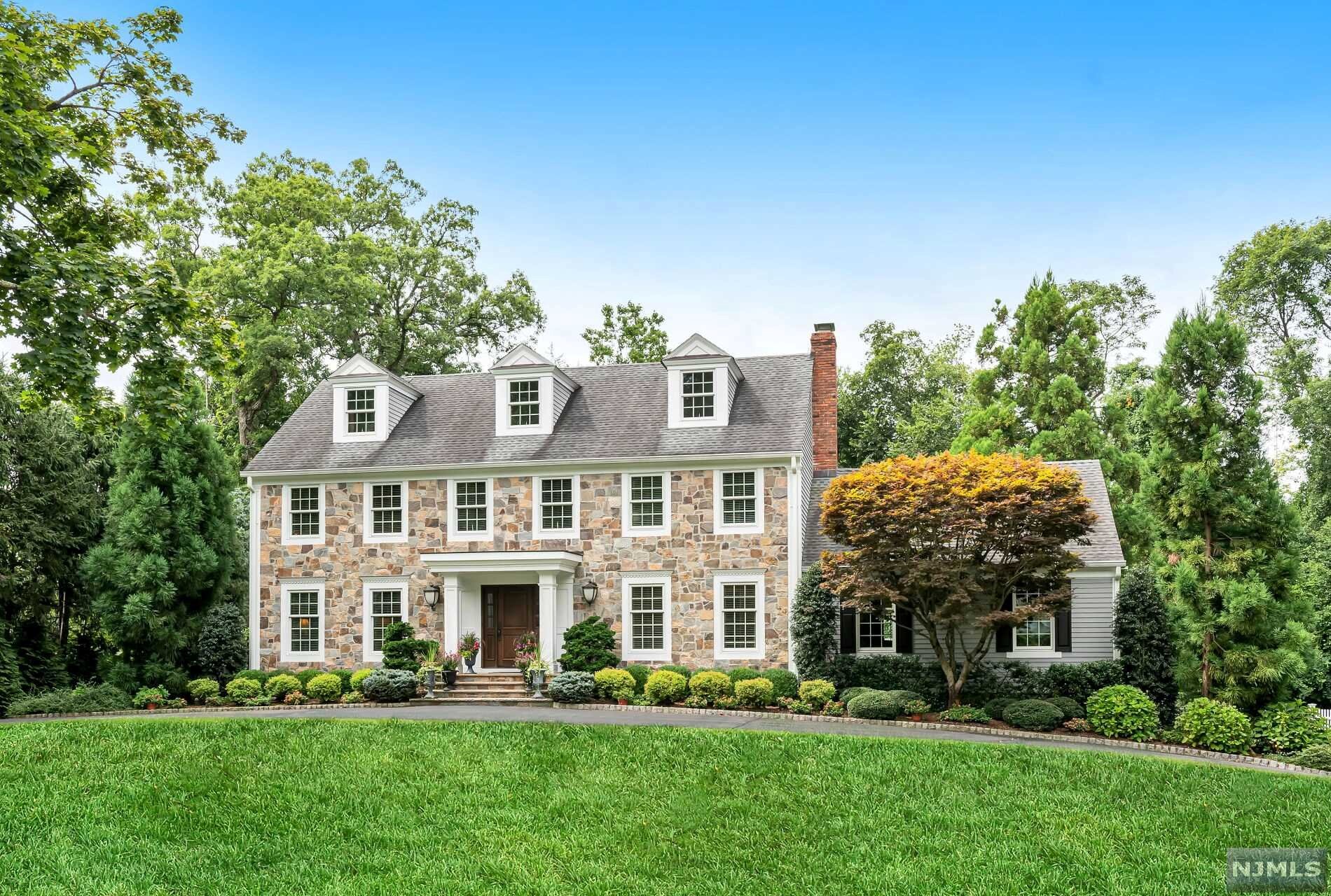 As you travel up the circular drive, be prepared to be swept away by the charm and beauty of this spectacular storybook home. This classic center hall colonial draws you in at every turn. Enter the home through the generous EF and glance into either the lovely formal LR or the beautiful sun drenched DR w custom moldings. The gourmet kitchen w top of the line appliances, high quality cabinetry, center island and Cesarstone countertops opens up to the family room w vaulted ceilings, gas FPL and sliding doors leading to patio. You will also find a fabulous newer full bath, additional bedroom/bonus room w laundry all on first floor. The 2nd floor has 4 bedrooms, which includes a gorgeous master suite w walk in closet/gleaming master bath w soaking tub, and an additional hallway bath. The lower level has a full kitchen, Rec room/sitting room, BR and full bath. Walk out to the pool, and impeccably landscaped rear yard. This home is meant to impress the most discerning buyer!