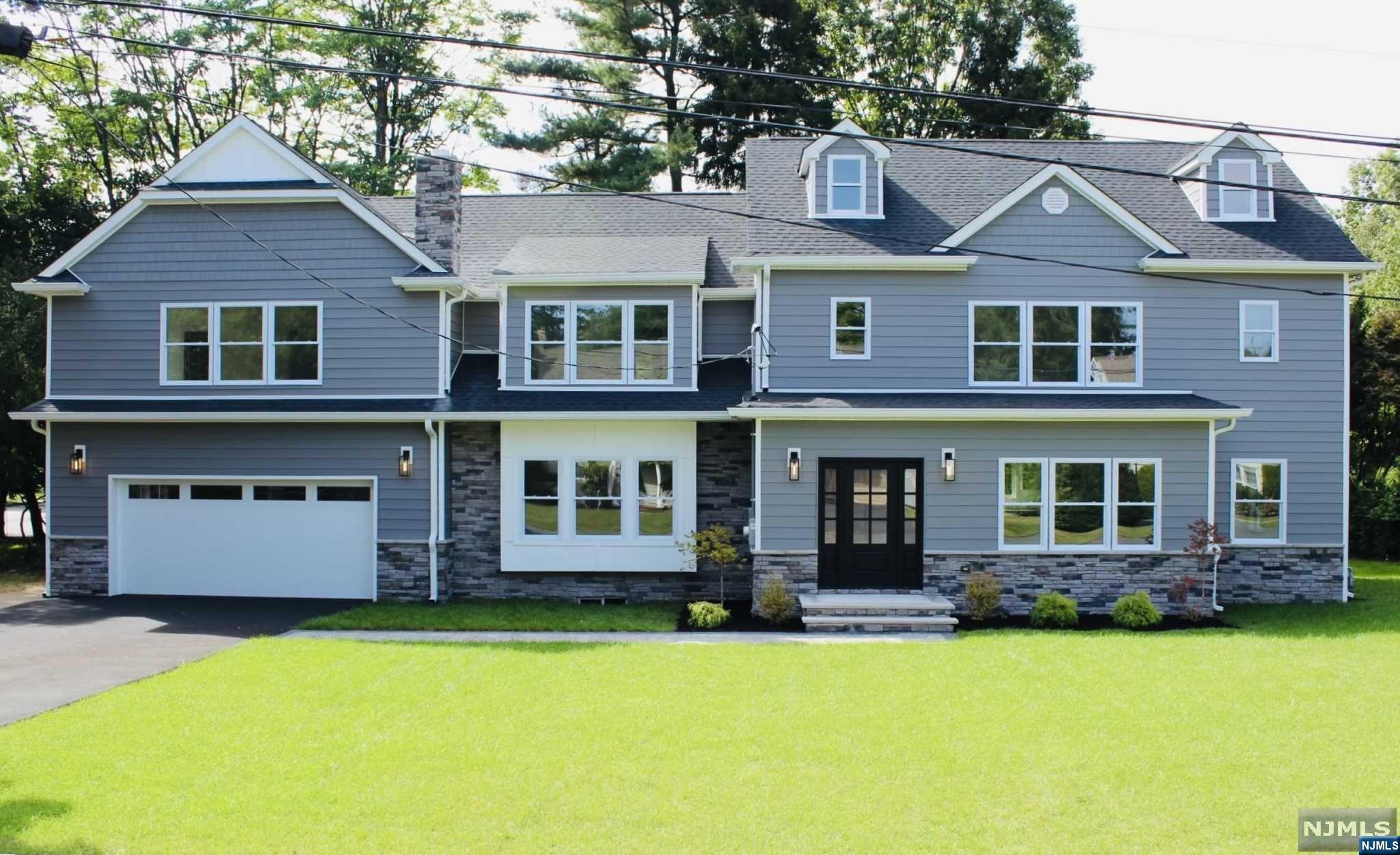 Welcome to this exceptional home that sits on a double lot where your possibilities for outdoor space are unlimited! This home beautifully blends classic elegance with modern amenities in the desirable town of Woodcliff Lake. Beautiful HW floors and abundant natural light welcome you to this 6 BR, 7.5-bath Colonial. The kitchen boasts white cabinetry, stunning quartz countertops w/ a waterfall edge island, and SS appliances. The spacious 1st floor layout includes a liv room, din room, kitchen, in-law suite & a convenient powder room. Upstairs, the primary suite features two walk-in closets and an en-suite bathroom complete with a soaking tub. On this floor there are 3 additional BRs, 3 full baths, and a laundry room w/ folding station & sink. The third floor offers another BR with a full bath, multiple closets, and walk-in attic storage. The basement provides great recreation space with a full bathroom. Other highlights include two-zone Heat and CAC and 2 Car attached garage.