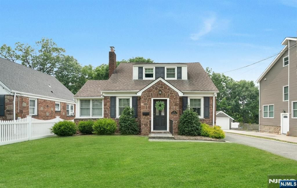 Full of character and thoughtful updates, this inviting home offers warmth and versatility from its charming sandstone front to its fenced property. Upon entry, a convenient cubby area provides the perfect spot for everyday essentials. The family room, complete with a fireplace, flows seamlessly into the kitchen with a seated island and dining area. A separate room with exposed brick, accessed through a paned glass door, offers flexible space for a home office, playroom, or den. Two spacious bedrooms and a full bath are located on the first floor, while the second level features two additional bedrooms and another full bath. The finished lower level expands the living space with a recreation area, laundry room, and workshop or private office. Hardwood floors, a flat backyard with a shed, and a Belgium block-lined driveway complete the property. Ideally situated in a desirable neighborhood close to downtown shopping, dining, and transportation to New York City, this home offered the perfect combination of comfort, convenience, and timeless appeal