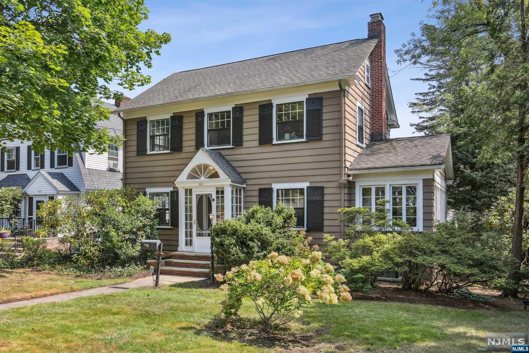 Enter the center hall of this 1920s-style home, and you'll find a formal dining room filled with natural light, a living room with a wood-burning fireplace, and custom built-ins. The sunroom off the living room brings the outdoors in with windows on three sides and a beautiful view of the rear garden and patio. Just off the eat-in kitchen is a pantry and mud room leading to a large deep yard with slate patios. On the second floor are four light-filled corner bedrooms, including a spacious primary bedroom and full bath. The third-floor attic can easily be finished to add a fifth bedroom and home office space. The basement has a finished play area, work room and laundry/full bathroom. Located between two train stations, Walnut Street Shopping and Farmers Market, and Brookdale Park, it is one of the best locations in town. Chimneys and flues are sold as-in conditions with no known issues.