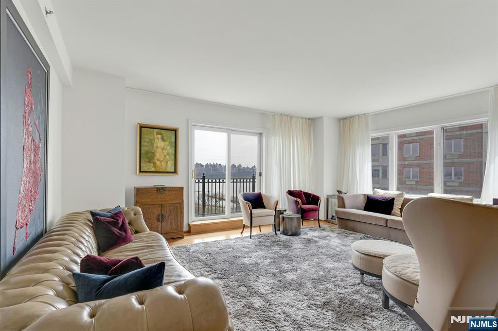 Welcome to 3219 City Place, Edgewater â€” a sun-filled 3-bedroom, 2-bath condo with views of the Manhattan skyline and Hudson River. This spacious 1696 sqft home features an open-concept living and dining area with hardwood floors, large windows, and abundant natural light. The modern kitchen is equipped with stainless steel appliances, marble countertops, and a breakfast bar. The primary suite offers generous closet space and a private bath, while two additional bedrooms provide flexibility for guests or a home office. Enjoy a private balcony overlooking Manhattan, plus the convenience of an in-unit washer and dryer. Ideally located in the heart of Edgewaterâ€™s waterfront, with direct access to the Hudson River Walk. Enjoy a vibrant mix of dining, shopping, and lifestyle amenities nearby. Whole Foods and Trader Joeâ€™s just a short drive away. Easy NYC commute via ferry and bus just steps from your door.
