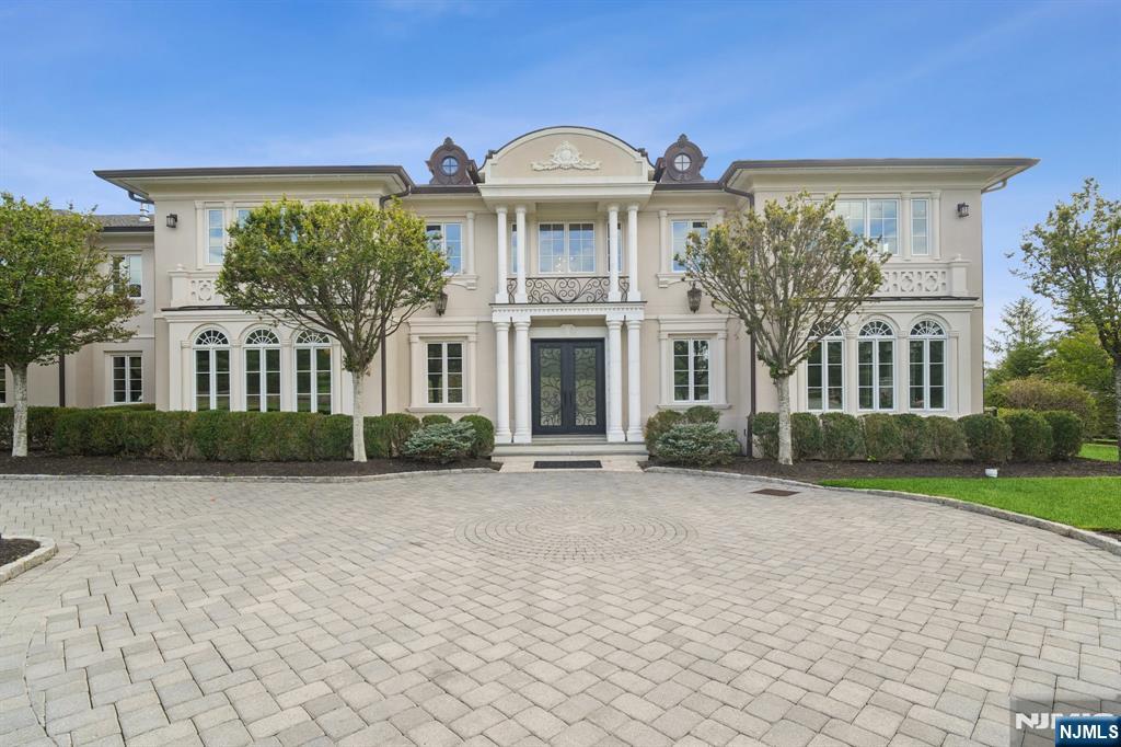 A European-inspired masterpiece blending French Chateau elegance with Mediterranean warmth. This stately Cresskill estate features a soaring double-height foyer with imported marble floors, a grand staircase, and crystal chandelier. The chefâ€™s kitchen boasts cherry wood cabinetry, Viking appliances, a granite island, and butlerâ€™s pantry. Entertain effortlessly in the dramatic great room with two-story windows, paneled fireplace, and seamless indoor-outdoor flow. A richly appointed library with mahogany millwork and fireplace offers the perfect work-from-home space. The luxurious primary suite includes a private lounge, dual fireplaces, walk-in closets, and a spa bath with soaking tub and marble shower. The fully finished lower level is an entertainerâ€™s dreamâ€”featuring a theater, gym, wet bar, and wine cellar. Step outside to a private resort-style backyard with heated pool, spa, and travertine patio. Located just 25 minutes from NYC, this home is timeless, turnkey, and truly one of a kind.