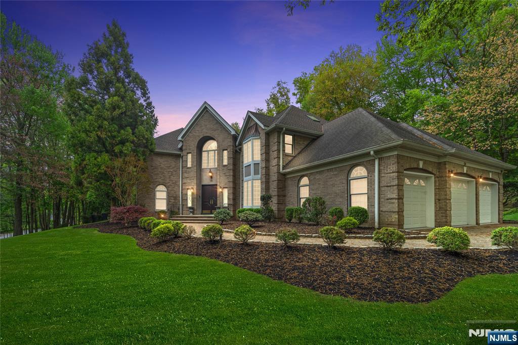 Situated in the highly desirable East Hill neighborhood, this impressive 7,531 sq ft brick Colonial, built in the 1990s and renovated in 2018, is set on nearly an acre of beautifully landscaped grounds with an in-ground heated pool and paver driveway. The main level features a grand two-story foyer, an expansive chefâ€™s kitchen with high-end finishes, formal dining room, sun-filled living room, and an inviting family room with fireplace. A flexible library or guest suite with a full bath completes this level. The second floor offers a luxurious primary suite with spa-like bath and soaking tub, along with three additional bedrooms, each with en-suite baths. The fully finished lower level is designed for entertaining and includes a billiard room, gym, theater, custom wet bar, and an additional bedroom with full bath. Located in a top-rated school district with convenient access to Manhattan, this exceptional home offers refined living and outstanding indoor-outdoor amenities.