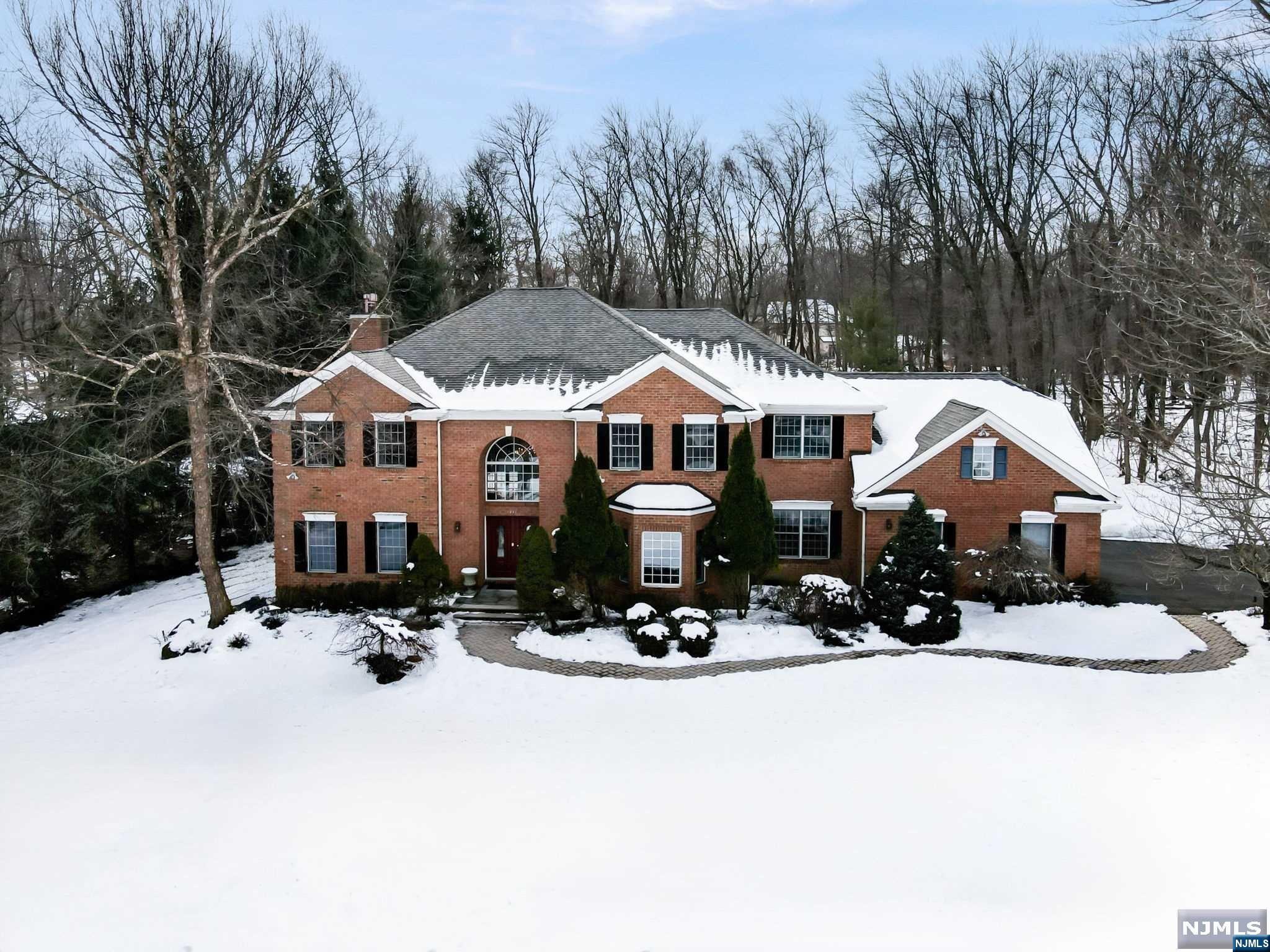 Immerse yourself in suburban luxury at this unrivaled entertainer's dream home! Set on a serene cul-de-sac, this exquisite colonial manor boasts a resort-like backyard with a remodeled gunite pool, hot tub, fire pit & gazebo with a fully-equipped kitchen & wood-burning pizza oven. Upon entering, a grand 2-story foyer sets the tone for the open layout flooded with natural light, high ceilings & hardwood floors. Seamless indoor-outdoor flow at the heart of the home connects the eat-in chef's kitchen w/ stainless steel appliances, family room w/fireplace and backyard oasis. Sophisticated den, dining room, bedroom, full bath, powder room & mudroom wrap up the 1st level. Exceptional primary suite with oversized closet, spa-like bath, and sitting/theatre room. Downstairs, find a show-stopping basement with a gym, expansive rec space, movie theater & full bath. Security system, whole house generator & sound system and 3-car garage. All this and just 30 min from NYC & near great schools!
