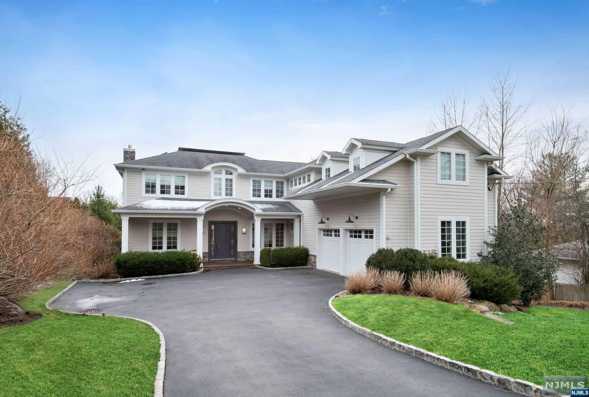 Welcome to this idyllic, custom built Hamptons-style home on Closter's prestigious East Hill. The sun-filled main floor features an office, living room/FP that flows into dining room & gourmet kitchen with high-end appliances & walk-in pantry. Laundry, mudroom, & powder room complete the main floor. The side staircase illuminated with large windows leads to second floor family room, elegant primary suite & bath, 2 bedrooms with J-&-J bath plus additional bedroom & bathroom.The lower level has everything a guest could imagine-an ensuite bedroom,sleek high-end imported kitchen, wine refrigerator,family room with walkout covered patio with infrared heaters. The property features a beautiful heated pool, indoor/outdoor surround sound stereo system, manicured landscape, heated drive & heated oversized 2-car garage, privately owned solar panels & large deck overlooking the property to capture the stunning sunset views.Walk to downtown Whole Foods,theater & eateries.Approx 5250 sq ft