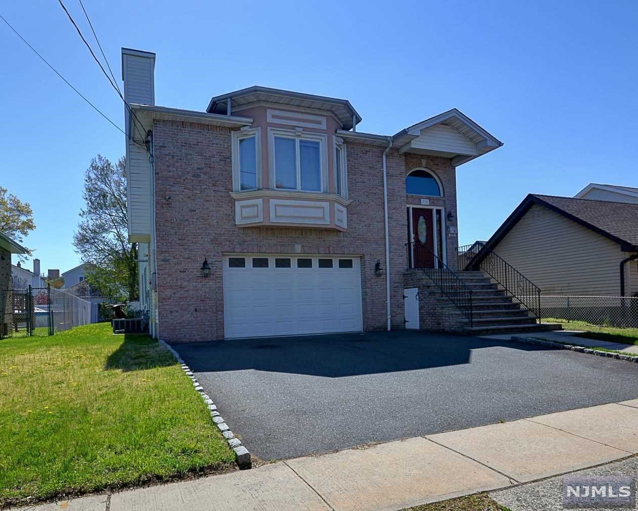 Lovely spacious Colonial home on a quiet Street.Large Custom Designed Kitchen with Center Is,Hard Wood Floors throughout 2nd floor features nice size living room with gas fire place.Beautiful dining room area, open floor concept with central unit.Master bedroom with master bedroom with large patio overlooking the beautiful backyard.2 other great size room with a bathroom.1st fl floor features 3 well size bedrooms with full bathroom and powder room.A separate kitchen with side entrance could easily be in law suite Buyer couldn't perform! Sold as Is!