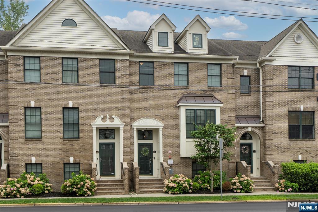 Modern three-level townhouse in prime Essex Fells location. This move-in-ready home offers a spacious two-car garage, extra storage, a laundry area, and a flexible bonus room on the entry level ideal as a third bedroom, office, gym, or guest space. Upstairs, the main living area features a wide-open layout with hardwood floors throughout, high ceilings, recessed lighting, and large windows that flood the space with natural light. The updated eat-in kitchen features new cabinets, granite countertops, and premium appliances, and flows seamlessly into the dining and living areas. Both bathrooms have been updated, with the primary bath featuring elegant marble finishes. The top floor includes an oversized primary suite with expanded walk-in closets, a generous second bedroom, and two full baths. A brand new water heater adds to the home's move-in-ready appeal. Throughout the home, details like wainscoting and thoughtful upgrades stand out. You're just minutes from NYC transit, local dining, shopping, parks, and country clubs everything you need within reach. HOA dues are $492/month and cover snow removal, landscaping, and common area maintenance. Nothing to renovate, nothing to replace just move in and enjoy.