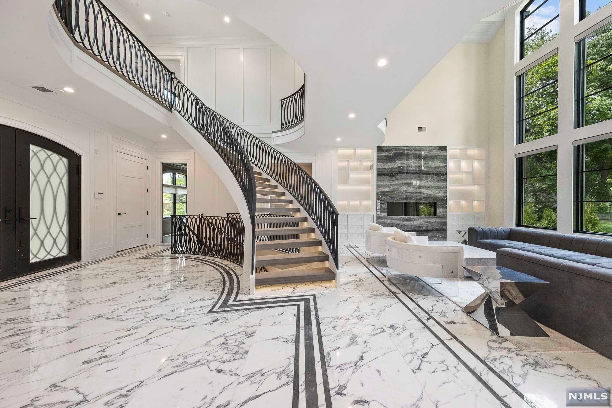 The VIRTUAL TOUR link for this listing contains an enormous amount of relevant information including a comprehensive video tour with hidden features & room dimensions, written description, additional photos, floor plans, and a complete interactive 3D model of the home. Absolute Masterpiece in ultra-desirable Demarest. Stunning French Chateau designed by renowned architect Robert Zampolin & highly regarded interior designer Ariella Horowitz. Built by experts, Fermano Builders. Nearly everything is custom. Some of the features include 5 bedrooms, 7 designer bathrooms, a fully custom designed kitchen w custom hood. Entire first floor of home plus all bathrooms feature radiant heated floors. Basements features Gym, Wine Bar, Wet Bar, Theater, 1/2 bath, Rec Room, Bedroom & Full Bath. Security, Back up generator, spray foam insulation, 3 car garage & SO MUCH MORE. Watch the video.