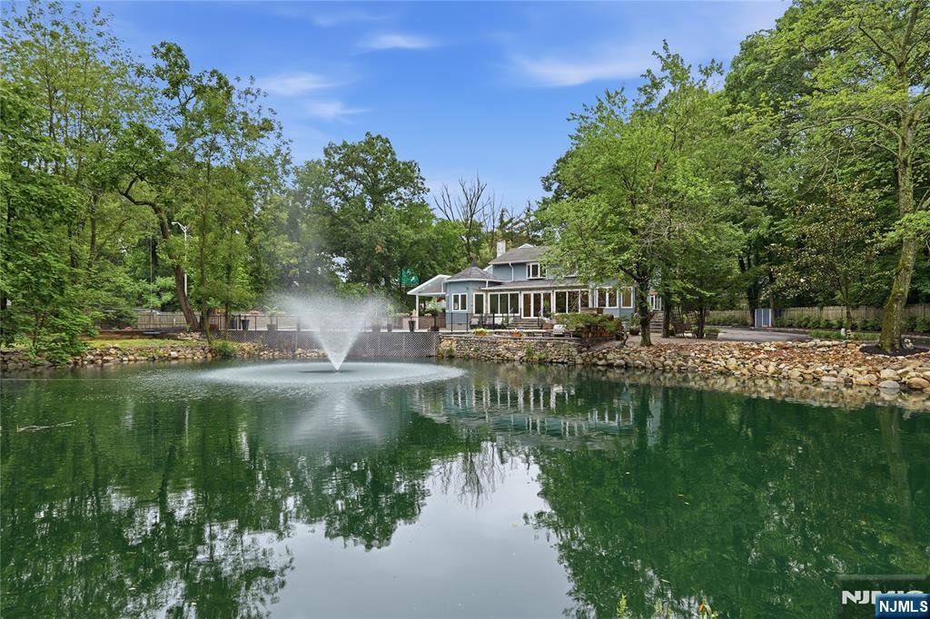 Tucked away in Wyckoffâ€™s desirable Sicomac section, set on more than 1.2 acres this exceptional estate offers the perfect blend of timeless elegance and vacation-at-home living. A long, private driveway welcomes you to this beautifully landscaped, level property featuring a heated gunite pool, dedicated outdoor full bath, custom grilling station, and a tranquil, self-sustaining goldfish pond with a picturesque walking path. With more than 6,000 sq. ft. of light-filled living space, this impressive home features 7 bedrooms and 5.5 baths. Oversized windows and glass doors creating a seamless connection between the grand interior living spaces and the spectacular, park-like backyard. The heart of the home is a expansive kitchen complete with custom cabinetry, a walk-in pantry, and an effortless layout designed for both everyday living and entertaining. Additional highlights include: Private first-floor guest suite with sitting room, full bath, and separate entrance, Library, Impressive skylit game room. Spacious two-car garage with a large unfinished second level, ideal for a future fitness studio, home office, or workshop. A truly rare offering, this distinguished estate combines exceptional scale, outstanding outdoor amenities, and beautifully designed indoor and outdoor living spaces, making it one of Wyckoffâ€™s most distinctive properties.