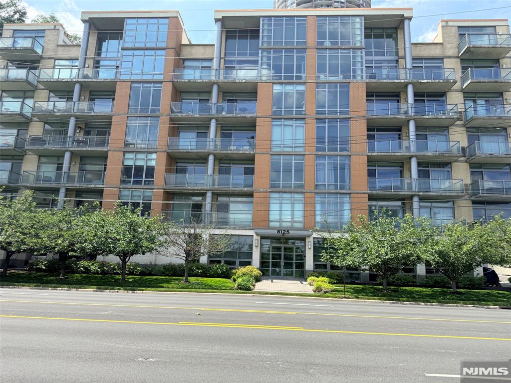 Experience luxury waterfront living in this stunning 2-bedroom, 2 full bathrooms condo with breathtaking panoramic views of the Hudson River. This beautifully maintained condo features a wraparound balcony accessible from both bedrooms and the living room, offering the perfect setting to relax and enjoy the spectacular river views. Modern Kit with granite countertops, SS appliances, new fridge, and an open layout filled with natural light. The primary suite includes a private bathroom, walk-in-closet, another closet, while the second bedroom is conveniently located near the second full bathroom, laundry area, new water heater (2023), 2 assigned parking spaces, Smart Thermostat, all hardwood floors, and Central AC. A variety of mass-transit options, including the bus to Port Authority, the Hoboken train, and the Port Imperial ferry. Schedule your private showing today