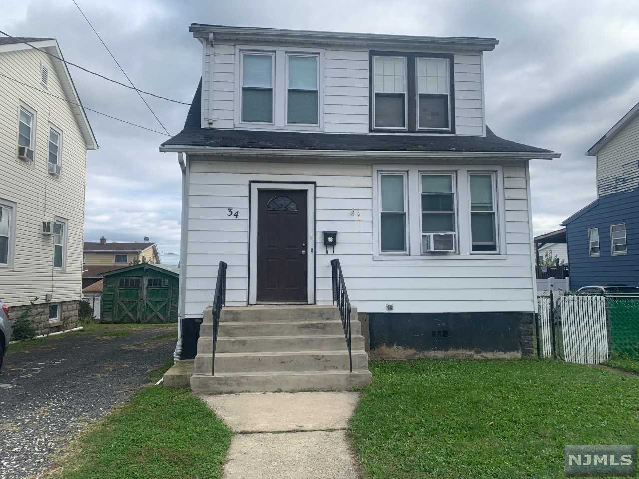 Large lot. Modern eat-in kitchen with oak cabinets. Living room has track lighting. Hardwood floors throughout. Large wood deck 13.4x18.2. New bath on 2nd fl. New gas range. Living Rm: 16.4x11.8, Dining Rm: 12.7x11.1, Kitchen: 16.8x7.5, Bedrooms: 10.7x14.1, 12x8.9, 8.1x7.8. Party driveway. Has room for a private driveway on the right side. Short Sale, subject to 3rd party authorization, as is condition. SHORT SALE APPROVED $370,000
