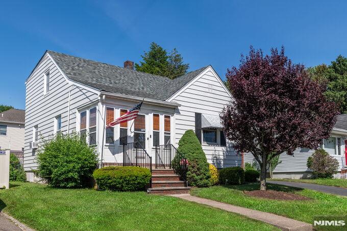 Welcome to this charming 4-bedroom Cape Cod nestled in a desirable Totowa neighborhood! Offering a versatile layout, this well-maintained home combines comfort, functionality, and convenience. The first flr features a bright and inviting Living Room filled with natural light, a Dining Room with beautiful hardwood floors, and an enclosed front porch that provides the perfect spot to relax with your morning coffee or unwind at the end of the day. The Eat-in-Kitchen offers plenty of room for everyday dining with easy access to a large deck overlooking the backyard ideal for outdoor gatherings. A convenient first-flr Bedroom and Full Bath provide flexibility for guests. Upstairs, you'll find a generously sized Primary Bedrm, two additional Bedrms, a cozy Den that can serve as a reading nook, workspace, or play area and the Main Bath. The finished Basement expands the living space with a Recreation Room perfect for entertaining, or a Gym. Additional basement features include a Laundry Rm, Workshop, and storage space to keep organized. An attached garage adds everyday convenience and protection from the elements. Ideally located near major highways, public transport, shopping, dining, and local amenities. With lower Passaic County taxes and a flexible floor plan designed to accommodate a variety of lifestyles, this home presents an outstanding opportunity to enjoy comfortable living in a highly convenient location. Don't miss your chance to make this wonderful home your own!