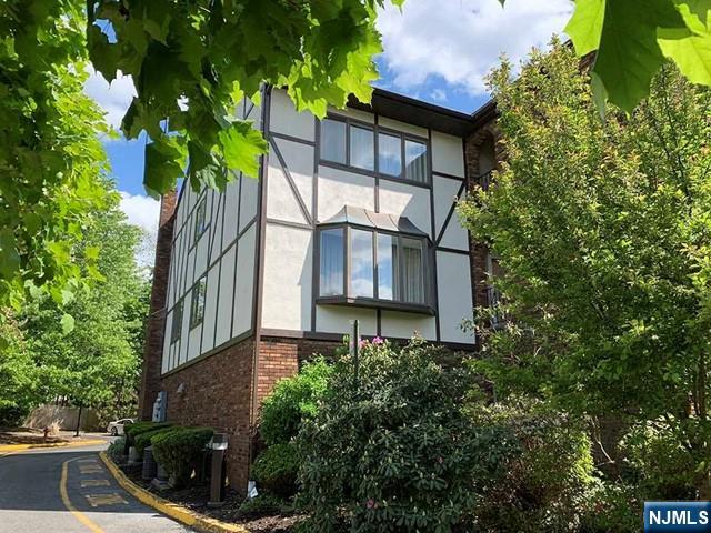 This large and sun-filled 3-bedroom townhome is ideally located just a short walk from both the bus stop and the train to Manhattan. Enjoy unmatched convenience with nearby shops, restaurants, major highways, parks, and local amenities all within minutes. Nestled in a well-known community surrounded by lush landscaping, this home features an open floor plan and generously sized rooms throughout. The main level offers a bright living room overlooking a massive dining area, an oversized family room with a wood-burning fireplace, and a beautifully updated kitchen with new cabinets, granite countertops, and stainless steel appliances. The tastefully renovated bathrooms add a modern touch. The private primary suite includes its own full bathroom and walk in closet, while the ground-level bonus room is perfect for a home office, guest room, or recreation space. A 2-car garage plus 2 additional outdoor parking spaces provide ample parking. Move-in ready, this townhome combines comfort, space, and an unbeatable location. A must-see!