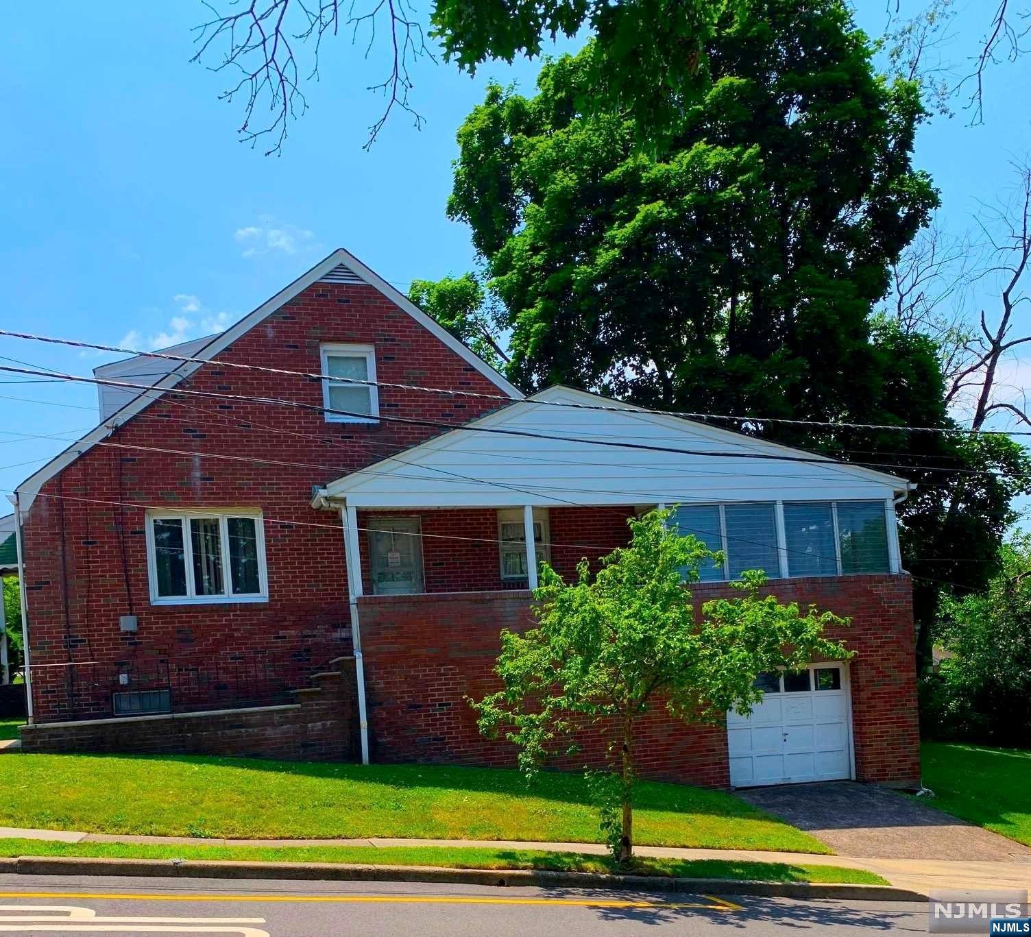 First time on market since built. Opportunity awaits a second owner. Enter this well built expanded brick cape, from your living room or side entrance to large kitchen. Enjoy the quiet neighborhood and view from the covered veranda at side entrance. One floor living complete with 2 bedrooms and full bath. Discover the beauty of the expansive family room overlooking the mountains and backyard. Large high ceiling basement has a laundry area and workbench, with ground level access to garage and yard. Second floor has a large bedroom, walk in closet and full bath. Solid residential area, possible mother/daughter near all highways and train station.