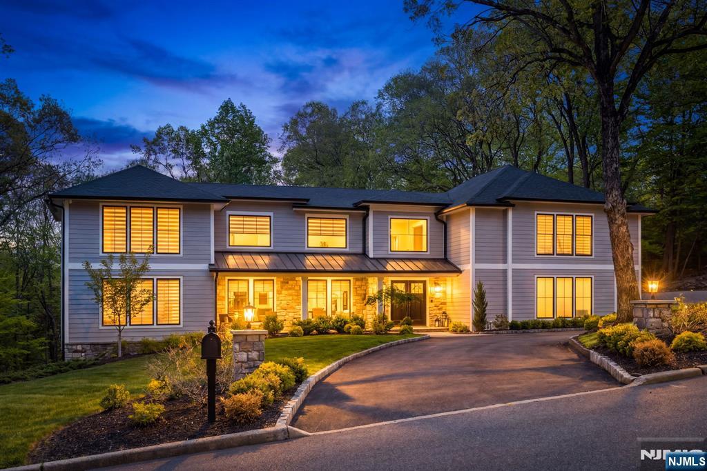 Experience this newly rebuilt architectural masterpiece with extended living set on a professionally landscaped one-acre estate in one of the areaâ€™s most coveted neighborhoods. This extraordinary three-story Colonial offers 6 bedrooms & 6.5 bathrooms, blending timeless elegance with sophisticated modern luxury across expansive, light-filled interiors designed for both entertaining & everyday living. A dramatic double-height foyer with designer lighting sets the tone for the homeâ€™s refined aesthetic. Multiple fireplaces, oversized windows, porcelain & ceramic flooring & bespoke finishes create an atmosphere of understated luxury throughout. The designer chefâ€™s kitchen is a true showpiece, featuring an oversized quartz waterfall island, custom cabinetry, farmhouse sink, walk-in pantry, striking brass-accented hood. The upper level is anchored by a stunning primary suite retreat complete with a sitting area, boutique-style two-story walk-in closet, additional custom closet space & a spa-inspired marble bath with soaking tub, oversized glass shower & dual vanities. Designed for exceptional versatility, the lower level is ideal for extended living with its own living & dining areas, kitchen & private bedroom accommodations with walk-out access to the grounds. Outside, the manicured property offers exceptional privacy and room for a resort-style pool and outdoor entertaining oasis. Convenient to schools, parks, shops, highways, & the Indian Trail Club.