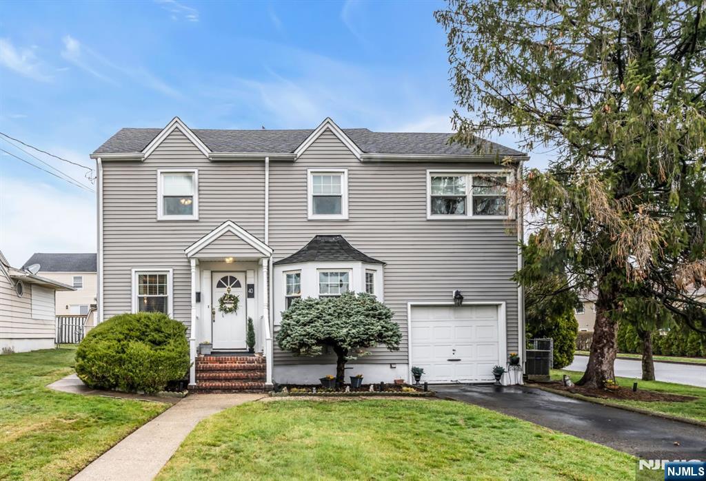 Located in the desirable town of Nutley, this Colonial offers a functional layout suited for everyday living and entertaining. The main level features a spacious living room, large dining room perfect for gatherings that flows into a bright eat-in kitchen. The kitchen showcases a large center island with granite countertops, abundant cabinetry and storage, stainless steel appliances including a double wall oven. Skylights and oversized windows bring in exceptional natural light, while direct access to the backyard supports easy indoor-outdoor living. First floor powder room for added convenience. The second level offers two bedrooms plus a flexible bonus room with potential as a third bedroom, private office, or guest space and the main bath. A partially finished basement with an additional half bath provides valuable extra versatility. Set on a corner property with a one-car garage, the home offers strong curb appeal and convenience. Close to parks, shopping, local amenities, and NYC commuting routes; the bus to NYC one block away and Delawanna Station 1.2 miles away.