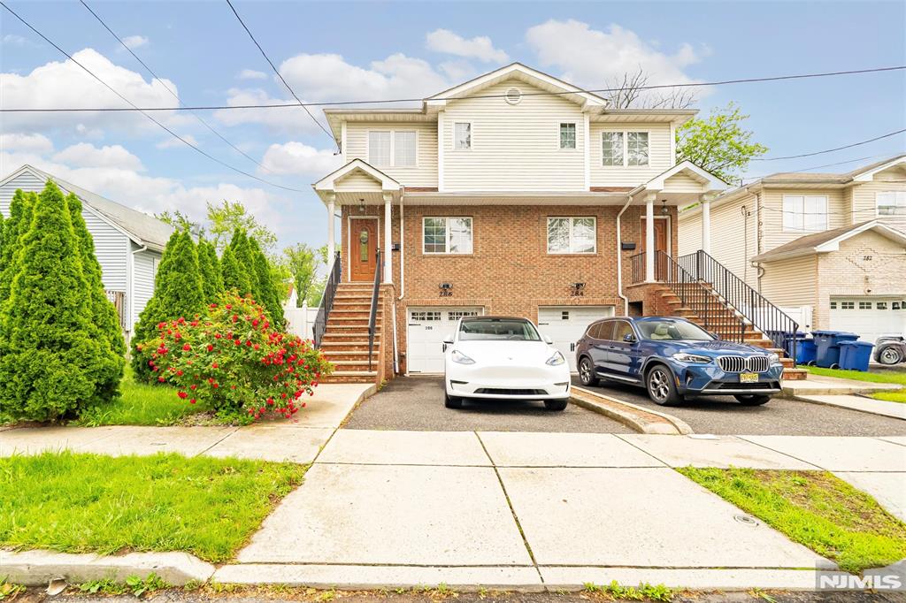 This beautifully maintained 3-bedroom, 3.5-bathroom duplex/townhouse offers spacious, modern living across three levels. Built in 2008, the home features a classic brick and vinyl exterior and an open-concept floor plan perfect for todayâ€™s lifestyle. Step inside to a bright and airy living room that flows seamlessly into the dining area and a well-appointed eat-in kitchen. The kitchen boasts cherry wood cabinetry, granite countertops, stainless steel appliances, and ceramic tile flooring. Sliders off the kitchen open to a private deck, ideal for outdoor dining and overlooking a fenced-in backyard. Upstairs, youâ€™ll find three generously sized bedrooms, including a primary suite with a tray ceiling, walk-in closet, and luxurious en-suite bath featuring a granite-topped double vanity and Jacuzzi-style tub with shower. Hardwood flooring runs throughout the second floor, which also includes a laundry room and ample closet space. The fully finished basement offers a cozy recreation room with gas fireplace, a full bathroom, utility/storage area, and direct access to the attached one-car garageâ€”perfect for a guest suite, media room, or home office. Located near shops, restaurants, parks, and NYC transportation, this home blends suburban comfort with urban accessibility. Donâ€™t miss this move-in-ready gem in the heart of Hackensack!