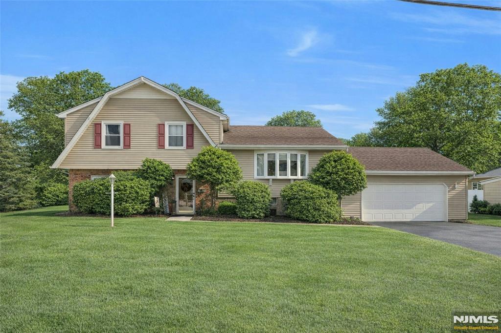 Immaculate Home in the Heart of River Vale! Step into this beautifully maintained home featuring a spacious entry foyer that leads to a large family room with a cozy fireplace and convenient half bath. Just a few steps up, youâ€™ll find a bright and expansive living room open to the dining roomâ€”ideal for entertaining. The exquisite gourmet kitchen features a large center island, granite countertops, custom cabinetry, and stainless steel appliances. The second level offers a generous primary suite with an updated full bath. Two additional bedrooms and a full hall bath completes this level. The lower level features a lovely den/recreation room, laundry room and storage. Outside, enjoy the lush, professionally landscaped property with a beautiful backyard and patioâ€”perfect for outdoor entertaining. Conveniently located close to top-rated schools, parks, and town amenities. Don't miss this MUST SEE Home!