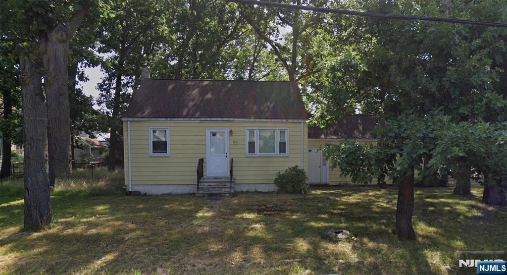 Exceptional opportunity to make this charming home your own. It is the perfect starter home or for anyone downsizing. The main level has the kitchen, living room, two bedrooms and a full bath. Upstairs you'll find a large unfinished attic, which can be finished for added living space. The property also features a screened in porch with a breezeway connecting to the one car garage. There is hardwood under the carpets, newer high efficiency boiler and 200 amp electrical service. Think of this home as a blank slate for your dream home!