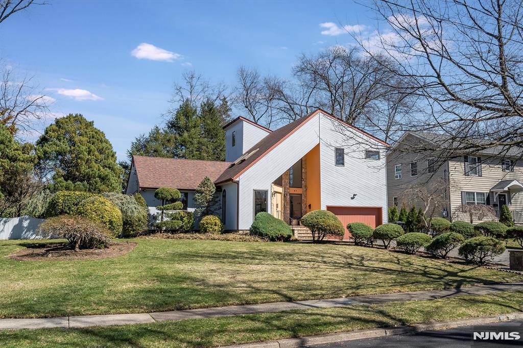 Modern luxury defines this stunning 4 BR,3.5 bath gem on 1 of Glen Rock's most sought-after streets.Spacious,airy open flr plan w/soaring ceilings & skylights.Dream kitchen,revamped w/10-ft Taj Mahal quartzite bcksplsh & waterfall island,SS appls,& sleek brass fixtures opens to FR w/stone fpl.2 BRs & renovated full bth are tucked away down the hall.Host in the living & dining rms & experience the convenience w/int access to 2-car garage.New Mirage HW flrs continue on stairs to the 2nd leve.Expansive PBR-a haven w/cedar WIC & new bth w/jetted tub,sep oversized shower & dble sink vanity.Another BR & renoâ€™d bth w/laundry completes level.Lower level offers sprawling rec rm & private home office,both w/radiant heat flrs,& addtl beautiful full bth.Enjoy exceptional property w/private yard & heated saltwater pool-waiting for you this summer!Too many updates to list!Lovely neighborhood w/in half block of neighborhood park,close to Glen Rockâ€™s top-rated schools & best NYC trans.