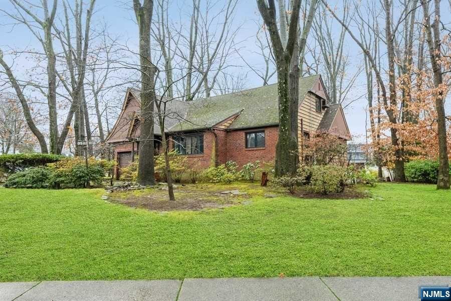 This is the one you have been waiting for. Amazing location - walk to park, school, train, bus and town center. A commuter's dream. Corner lot with 2 driveways, built in barbeque. Hardwood floors, whole house generator, finished basement with wet bar. Windows replaced.