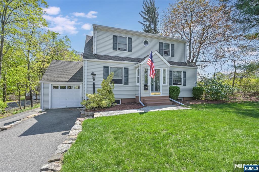 Welcome home to this charming 3-bedroom, 2.5-bath Cape Cod nestled on a beautifully manicured, private wooded lot. A welcoming vestibule leads into the spacious living room filled with natural light. A wide cased opening connects to the elegant dining room, ideal for intimate dinners or lively gatherings. The updated kitchen features custom cabinetry, quartz countertops, stainless steel appliances, and bar stool seating. Off the kitchen, the cozy three-season room offers a serene retreat leading to the backyard. A full bath completes the first floor. Upstairs, the spacious primary bedroom and two additional generous bedrooms share a full bath with a tub/shower. The fully finished basement offers versatility with a family room, dining area, second kitchen, and full bath. A one-car attached garage, two driveways, a storage shed, and a large fenced backyard with a paver patio complete the home. Perfect for entertaining, relaxing, or everyday living, this home blends comfort, character, and functionality.