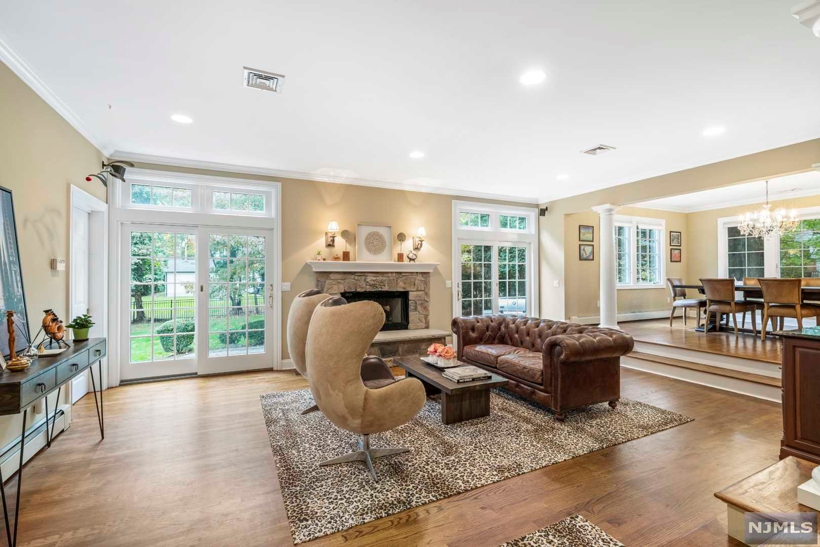 Beautifully updated,expanded center hall Colonial with quality craftsmanship throughout. The entrance foyer leads to the formal living rm, library/home office, gourmet kitchen with beautiful maple cabinetry, center island, dining rm, media rm, great rm w/fireplace w/doors to deep and private backyard with paver patio and basketball court, mudroom and laundry rm lead to 2 car garage. The 2nd fl has a magnificent master suite w/fireplace, large walkin closet, built-ins and master bath, 3generous sized bdr and family bath. Finished basement plenty of storage. Other features include radiant heat in kitchen, 5 heat zones, 2A/C zones. Great location.Few blocks from top blue ribbon schools/ NYC transportation.