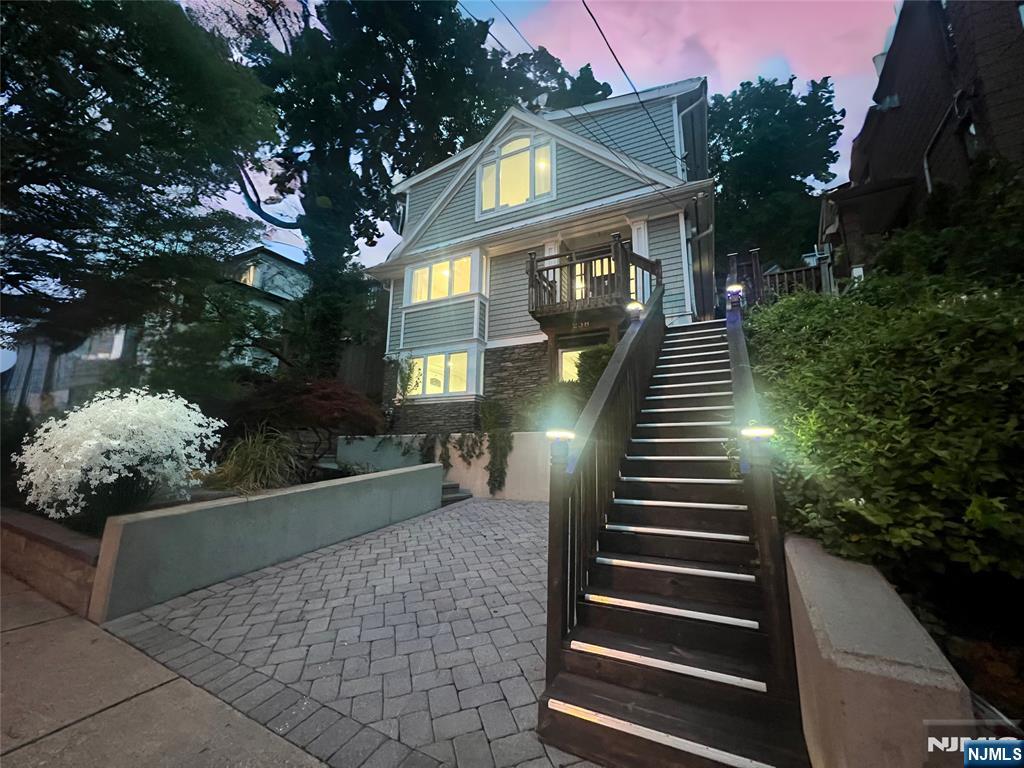 Welcome to this stunning Center Hall Colonial, boasting breathtaking 180-degree views of the NYC skyline. Featuring 3 spacious bedrooms and 2.5 bathrooms, this home offers the perfect blend of comfort, luxury, and entertainment across three versatile levels. The open-concept main level welcomes you with a grand living room, ideal for gatherings, while the gourmet kitchen and dining area flow seamlessly onto a wrap-around deck with multiple entry points, creating an entertainerâ€™s dream for summer barbecues or serene evening dinners under the stars. Upstairs, the crown jewel master suite greets you with panoramic skyline views and an elegant on-suite bathroom complete with double vanity, shower, and jacuzzi tub â€“ a true private oasis. The full finished basement with walkout access offers additional living space, ideal for a home office, gym, recreation room, and or guest suite. Outside, enjoy your private backyard getaway with an out house, perfect for entertaining, gardening, or peaceful relaxation. Located in a prime Edgewater location, just steps from top schools, parks, transportation, shopping, places of worship, and renowned dining options - this home offers unparalleled access to everything you need. Donâ€™t miss your chance to own this elegant colonial with unmatched NYC views and timeless living. Priced to sell, this will not last â€“ schedule your private tour today.