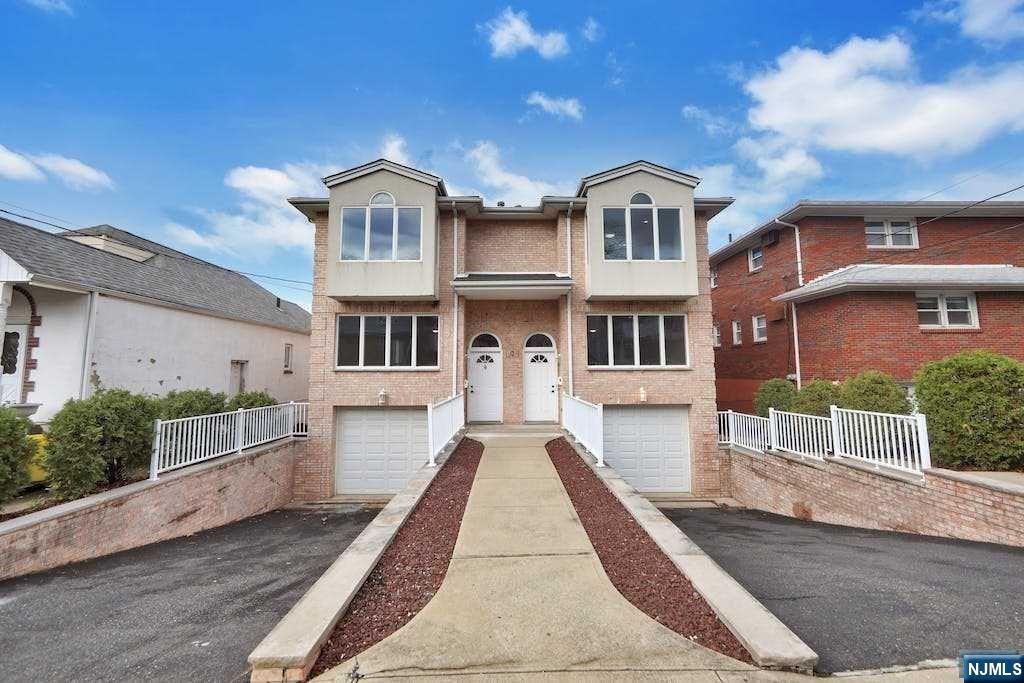 Fully Renovated Duplex 2 family brick house with total 6 Bedrooms 5 Bathroom 2 half bathroom, B unit finished ground floor included 2 rooms, full bath, family room door excess to side yard, 2 car garages, throughout hardwood floor, both unit with separate utilities and, central vacuum. This large side by side two families with 3,700 sf living space, and convenient location close to shopping, restaurants, school and worship, bus to New York. This property can be owner occupy or for investment with good income.