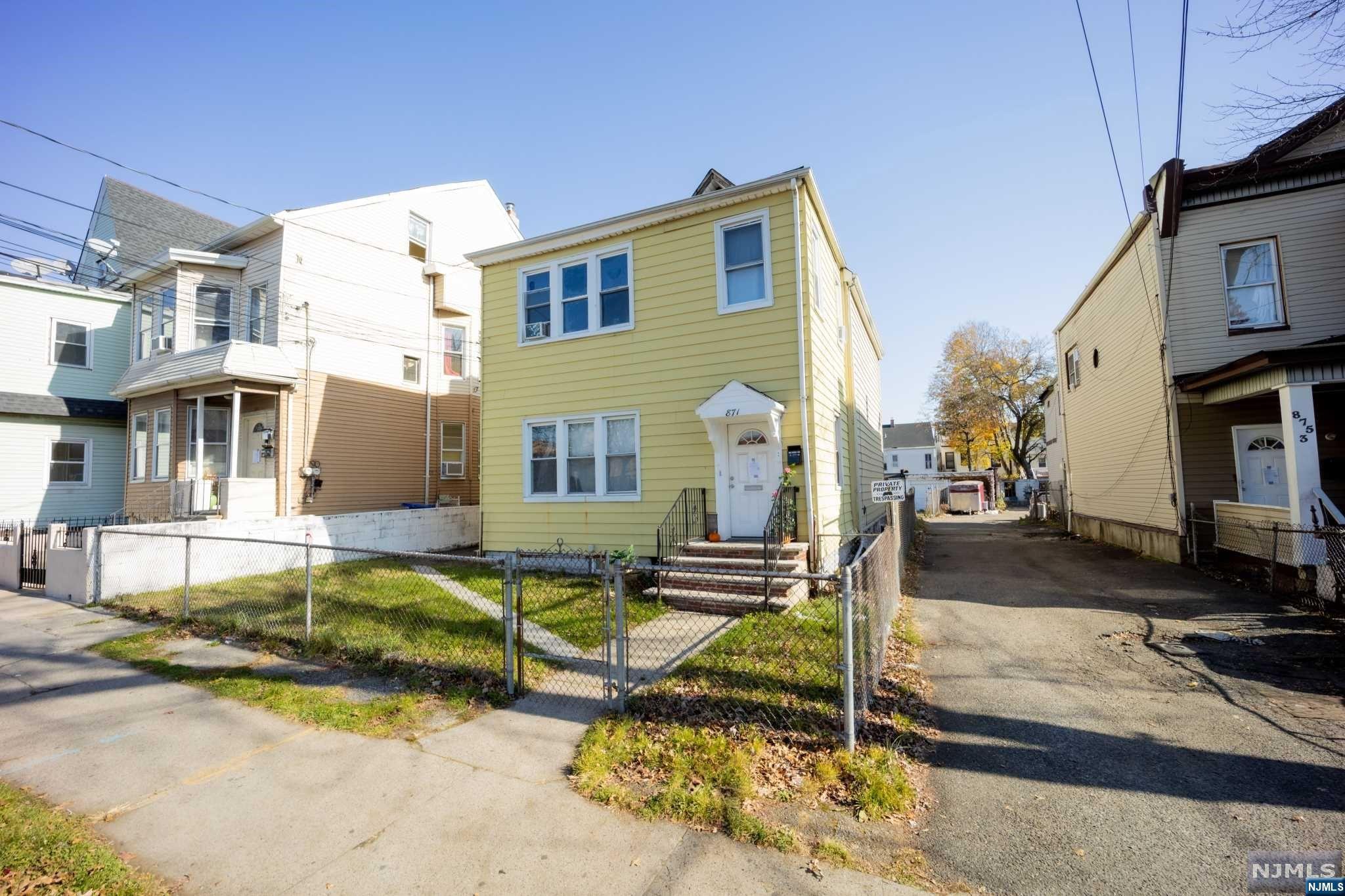 Large Home with tons of potential strategically located. Home can use some. Each floor is over 1300 SQF and provides plenty of space. Gas Heat and Separate Utilities. 1st Floor Consist of 4 Good Size Bedrooms, Living Room, Full Bath and EIK. 2nd Floor also comes with 4 Good Size Bedrooms, Living Room, Full Bath and EIK. Home has a Walk Up Finished Attic and Semi-Finished Basement. Home comes with 5 Detached Garages, Nice Size Back Yard Area. Home comes with a separate lot which provides a right of way: Block 9001 Lot 32. Being Sold "as is", seller will not perform any repairs.