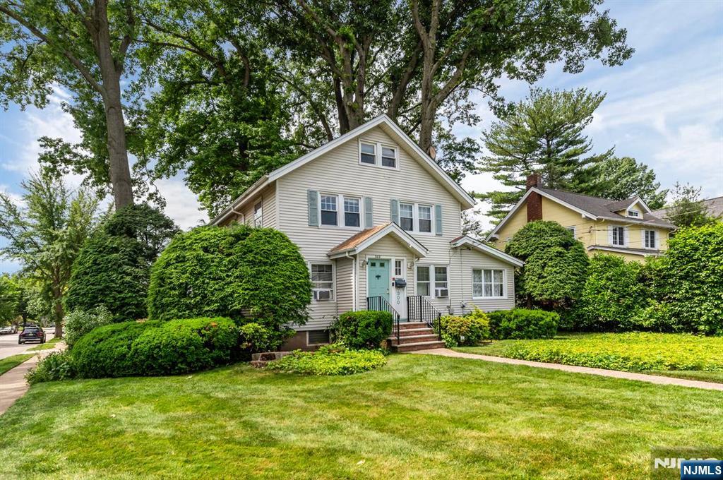 Welcome to this classic Teaneck Colonial, ideally located south of Cedar Lane on desirable Palmer Avenue. This charming home features a welcoming entrance hall, spacious living room, cozy den, formal dining room, bright three-season room, kitchen with breakfast nook, and a convenient powder room on the first floor. The second floor offers three comfortable bedrooms, a full bath, and access to a walk-up attic, providing excellent storage or future expansion possibilities. The full unfinished basement offers additional space for storage, a workshop, or future finishing. Enjoy the outdoor living area featuring a deck, patio, and a detached one-car garage. Conveniently located near parks, schools, shopping, houses of worship, NYC transportation, and major highways, this home offers the perfect combination of character, comfort, and accessibility. Don't miss this wonderful opportunity to make this traditional Teaneck Colonial your own!