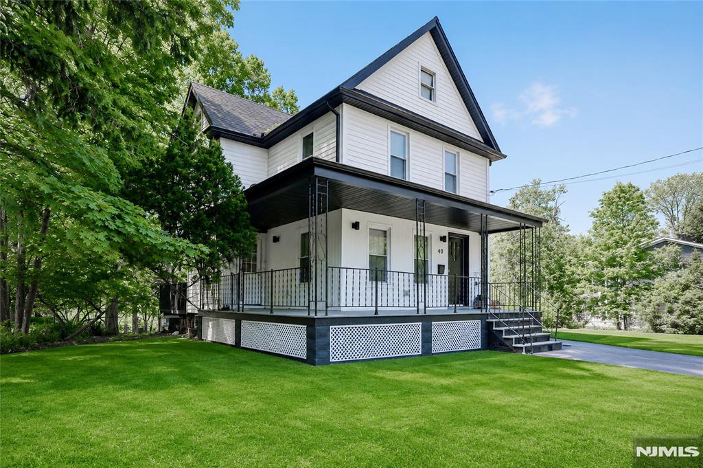 Move right into this beautifully renovated home, completely transformed in 2024, ideally located in the heart of desirable Cresskill just steps from the vibrant downtown district & highly acclaimed Cresskill High School. This sun-filled residence welcomes you with a charming spacious front porch leading into an inviting entrance foyer and an exceptional open-concept living/dining/kitchen space designed for todayâ€™s lifestyle. The stunning chefâ€™s kitchen features custom white shaker cabinetry, stainless steel appliances, oversized center island with quartz countertops, solid oak flooring, & direct access to a large private deck overlooking the deep backyardâ€”perfect for entertaining or relaxing outdoors. A stylish new powder room completes the main level. The second floor offers a spacious primary suite w/a gorgeous new primary bath, 2 additional bedrooms & another beautifully renovated full bath. There is also an unfinished basement that's ideal for storage or future possibilities. Additional highlights include a deep driveway, gleaming hardwood floors, updated windows, updated HVAC, and a private rear yard. An incredible opportunity to live in a truly move-in-ready home in one of Bergen Countyâ€™s most sought-after communities, known for its top-rated schools, charming shops & outstanding dining options.