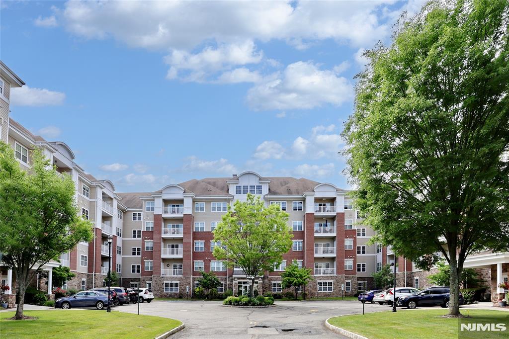 More than a home...it's a lifestyle! Two deeded underground parking spots, # 87 and 33, and a 6x10 deeded storage unit next door, #2C, are a few of the amenities of this 1768 SF Colfax unit in the Del Webb 55+ active adult community of Wanaque Reserve. Some other great things about this home is that it is next door to the 20,000 SF clubhouse...the indoor and outdoor pools, cafe, exercise room and the more than 45 clubs and activities, as well as a gatehouse which provides 24-hour security. The home features a living room with sliding doors, which open to a private balcony, dining room, den/home office with French doors, adding a touch of elegance, eat-in-kitchen with plenty of cabinets and pantry, laundry room off the kitchen, primary bedroom ensuite with tray ceiling, walk-in-closet and another closet, full bath with walk-in-shower, double vanity and private toilet room, 2nd bedroom, and full bath. Some of the clubs and activities include the travel club (four or five trips as well as several casino trips each year), tennis, pickleball, canasta, mahjong, poker, ballet, art classes, etc. Wanaque Reserve offers a luxurious lifestyle for its residents with a focus on modern amenities, security, and a sense of community. The recent renovation adds a fresh and updated living environment.