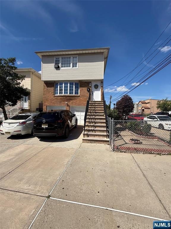 2 Family Home corner property with 2 car garage! Excellent opportunity for investors or owner-occupants! The vacant first-floor unit offers 3 bedrooms, 1 full bath, spacious living room, and formal dining room. The tenant-occupied second-floor unit features 2 bedrooms, 1 full bath, living room, and dining room. The ground level includes additional finished space with a summer kitchen, living room, 1 bedroom, and 1 full bath. Conveniently located near shopping, schools, parks, and transportation. Property being sold strictly AS IS.