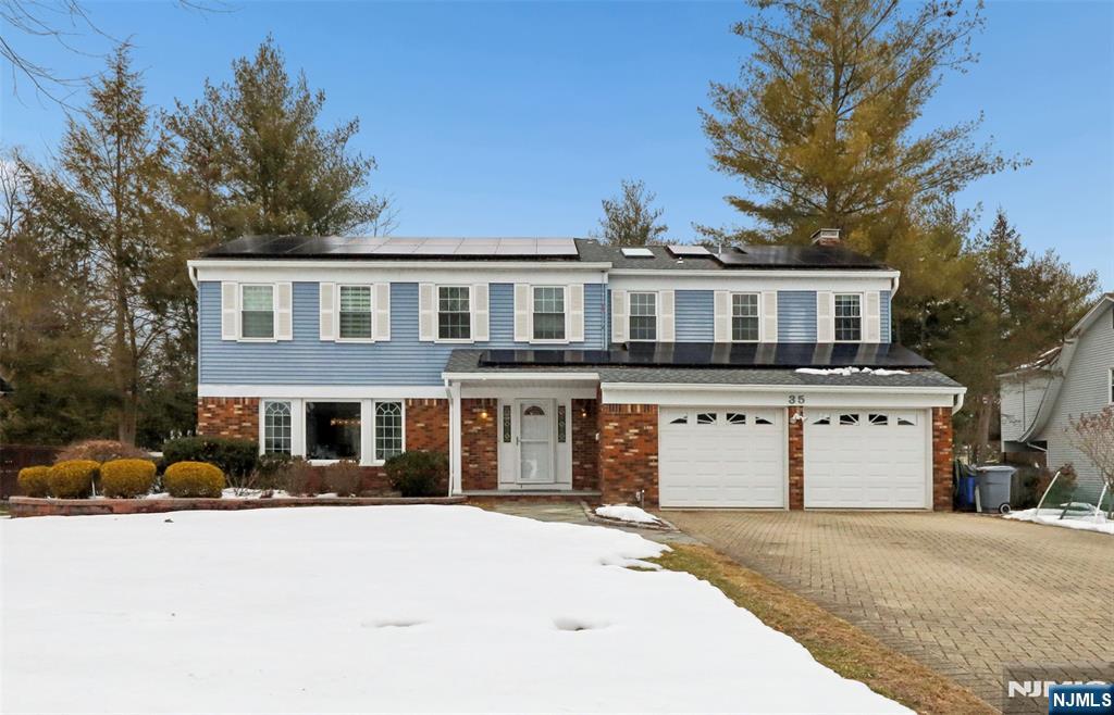 This fabulous Colonial offers 4 spacious bedrooms and 3.5 bathrooms, ideally located in a highly rated Blue Ribbon school district. Nestled on a quiet cul-de-sac, the home features a dramatic great room with soaring cathedral ceilings and abundant natural light, overlooking a beautifully landscaped backyard. Highlights include a private outdoor swimming pool, tastefully renovated bathrooms, a cozy wood-burning fireplace, generously sized bedrooms, and a thoughtfully designed, functional basement. Solar panels provide impressive energy efficiency and significant savings on electricity costs. Perfect for entertaining, the home also boasts a multi-level deck ideal for gatherings and outdoor enjoyment. A rare opportunity in Closter, this exceptional property seamlessly blends comfort, convenience, and timeless style.