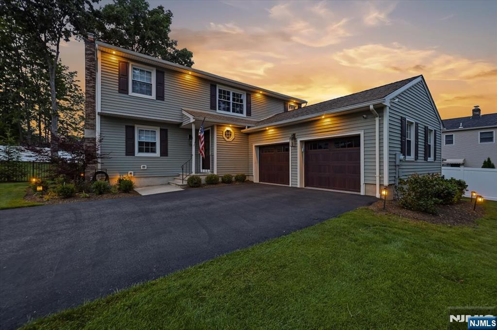 Tucked away on a quiet Wyckoff cul-de-sac, this impressive 4-bedroom, 3.5-bath Colonial offers the perfect blend of elegance, comfort, and modern updates. Designed for both everyday living and entertaining, the home features spacious living areas, a finished lower level with a full bath, and a functional layout that accommodates today's lifestyle. The outdoor living experience is a standout feature, showcasing a brand-new paver patio surrounding the beautiful inground pool, professionally designed landscaping, and landscape lighting that transforms the property into a beautiful evening retreat. Recent upgrades, including new garage doors and extensive exterior improvements, enhance both curb appeal and enjoyment. With generously sized bedrooms, multiple gathering spaces, and a sought-after Wyckoff location close to schools, parks, shopping, and transportation, this home presents a rare opportunity to enjoy refined suburban living in one of Bergen County's most desirable communities.