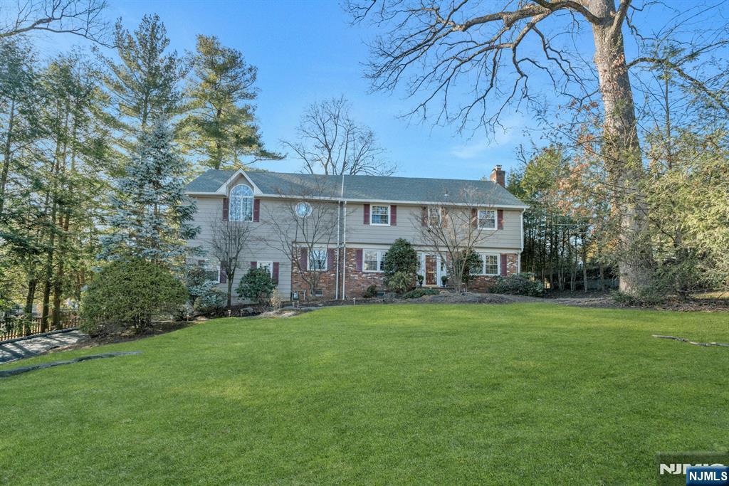 Discover timeless elegance and modern comfort in this elegant colonial home, ideally situated on prestigious Crest Road with breathtaking views of New York City. Unbeatable location just steps from top-rated schools, NYC trains and Ridgewood's vibrant downtown. Boasting an Ulrich-designed kitchen, a first-floor laundry room, and a luxurious primary suite with a spa-like bath and expansive walk-in closet, this residence epitomizes luxury living. The additional family room features vaulted ceilings overlooking a beautifully landscaped yard, complemented by a formal living room, dining room, and an inviting first-floor office space. With an attached oversized two-car garage, whole-house generator, large basement, newer windows and new 2024 roof & gutters, this home seamlessly combines convenience with sophistication, making it a rare gem in Ridgewoodâ€™s sought-after Heights neighborhood. A rare opportunity - the perfect blend of privacy and prestige!