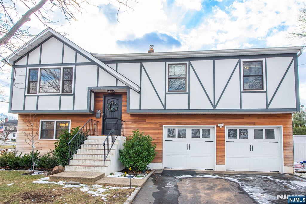Welcome to this sleek and modern bi-level offering 3 bedrooms PLUS an additional room (currently used as a home office). The main level features soaring cathedral ceilings and includes living room, dining room and stylish open-concept kitchen with hardwood floors, stainless steel appliances, quartz countertops and oversized center island. Just down the hall youâ€™ll find the primary suite with an ensuite bath and spacious walk-in closet, a second bedroom, fully updated hall bath and the additional room. On the ground level, you'll find another bedroom, a full bath with soaking tub, and a bright family room that opens directly to a private stone patio and fenced backyard. Additional features include: central ac, attached two-car garage, w/d and backyard playset. Pet-friendly and No smoking. Tenant responsible for first $200 of each repair. Unfurnished. Located on a quiet, tree-lined street just minutes from top-rated Westfield schools, shopping, dining, and NYC trains.