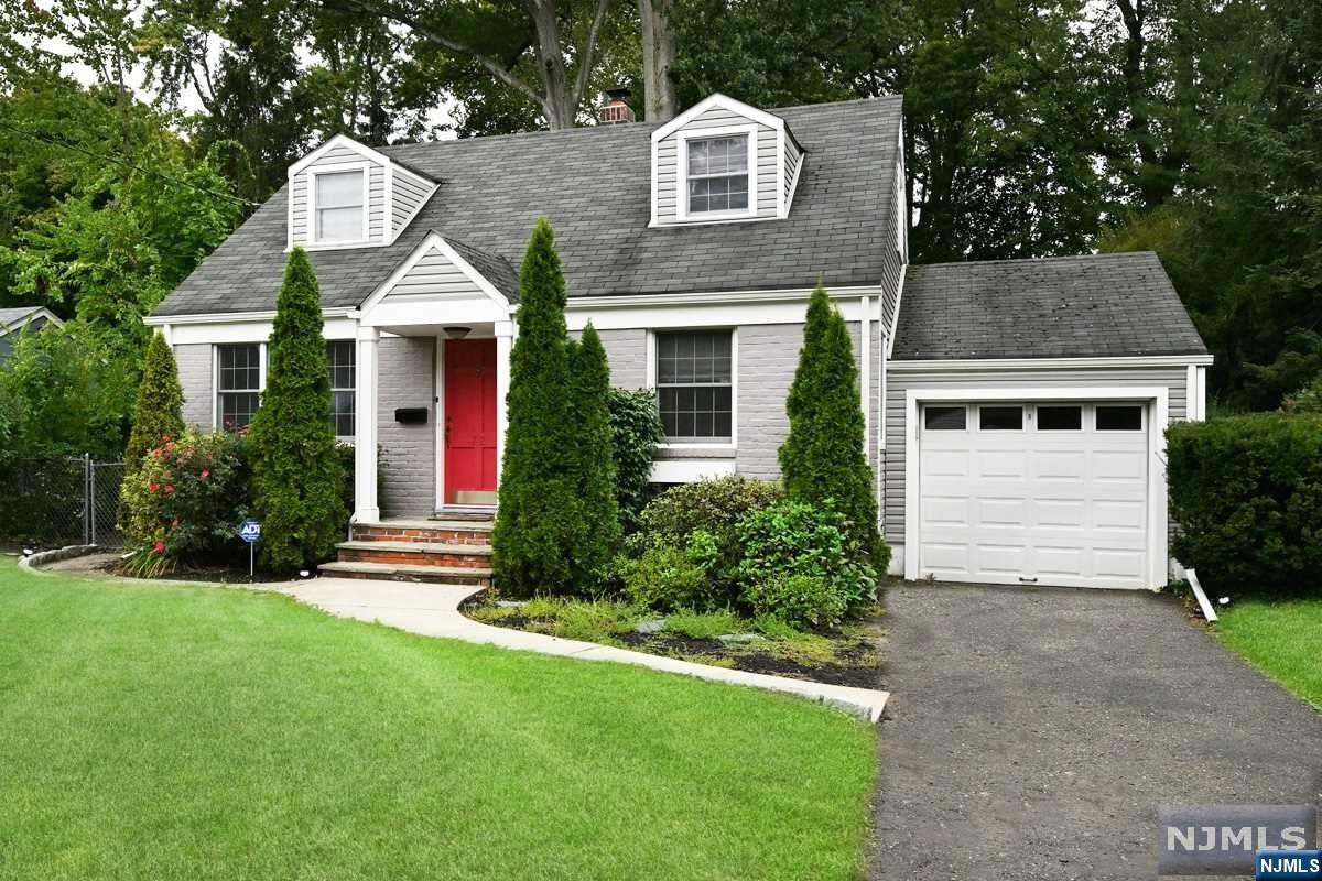 Lots of charm! Living room, newer kitchen with granite counters, 5-burner gas stove, stainless steel appliances, pantry with roll-outs, tumbled marble backsplash. Two bedrooms on the first floor. Second floor with office/sitting room, bedroom and storage. Wood floors, central air conditioning. Full basement with laundry. Large deck overlooks the private, well-landscaped, 170' deep lot. Convenient location with the Ridgewood Duck Pond & extensive bike path, NYC bus and access to major highways all nearby. Come and enjoy living in this beautiful community which features top-rated schools and a vibrant downtown center.
