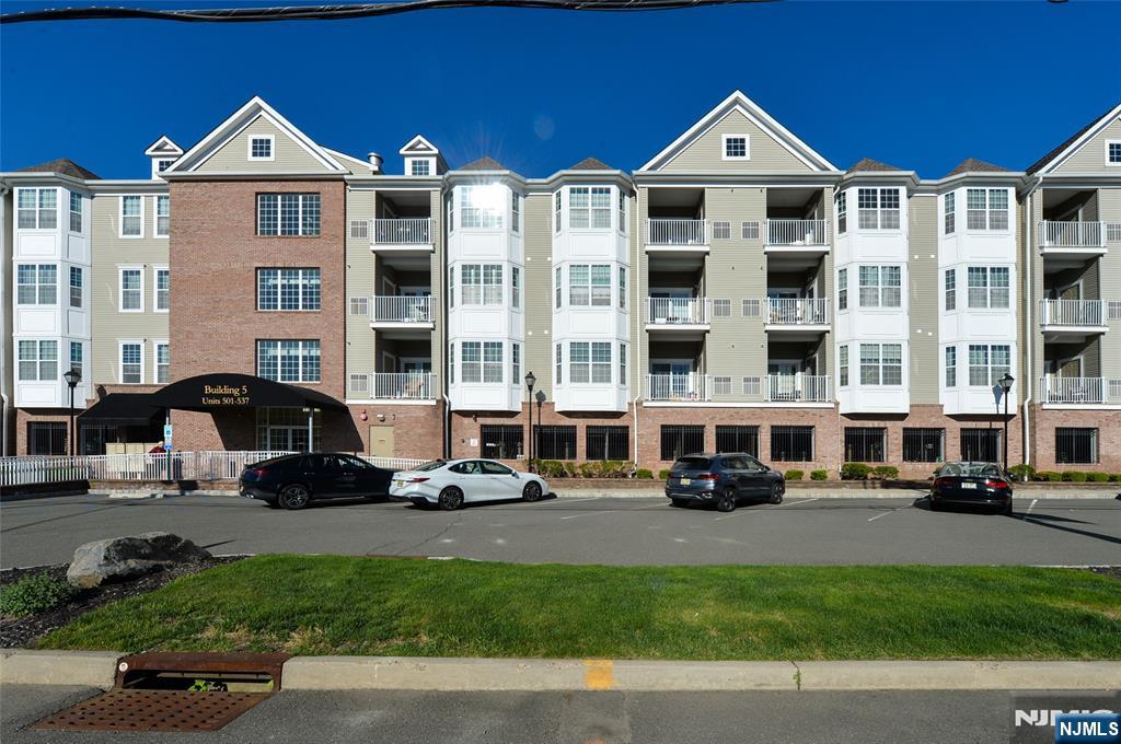 Welcome to 503 Bushes Lane! This bright and inviting, well-maintained 1-bedroom, 1-bath condo is located in a desirable 55+ adult community. Featuring spacious rooms, high ceilings, and sliding doors that lead to a covered balcony, this home offers both comfort and style. Enjoy hardwood floors throughout and the convenience of an in-unit washer and dryer. The community clubhouse boasts a cozy fireplace and large flat-screen TV, perfect for gatherings, along with an outdoor heated pool and an exercise room overlooking the pool. Clubhouse can be rented for events. Additional highlights include one covered parking space with an attached storage unit. A true must-seeâ€”shows beautifully!