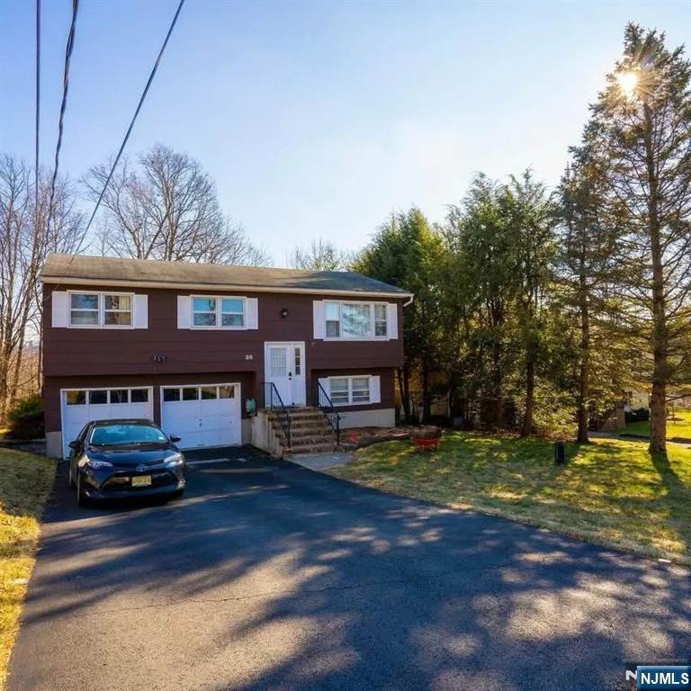 This updated Bi-level home offers lots of natural light and open space. Dining room leads straight to the deck area. Deck oversees wide landscape. Great for BBQ and entertaining. Lower level has a separate entrance and can be used as a spare bedroom, office, family or playroom.