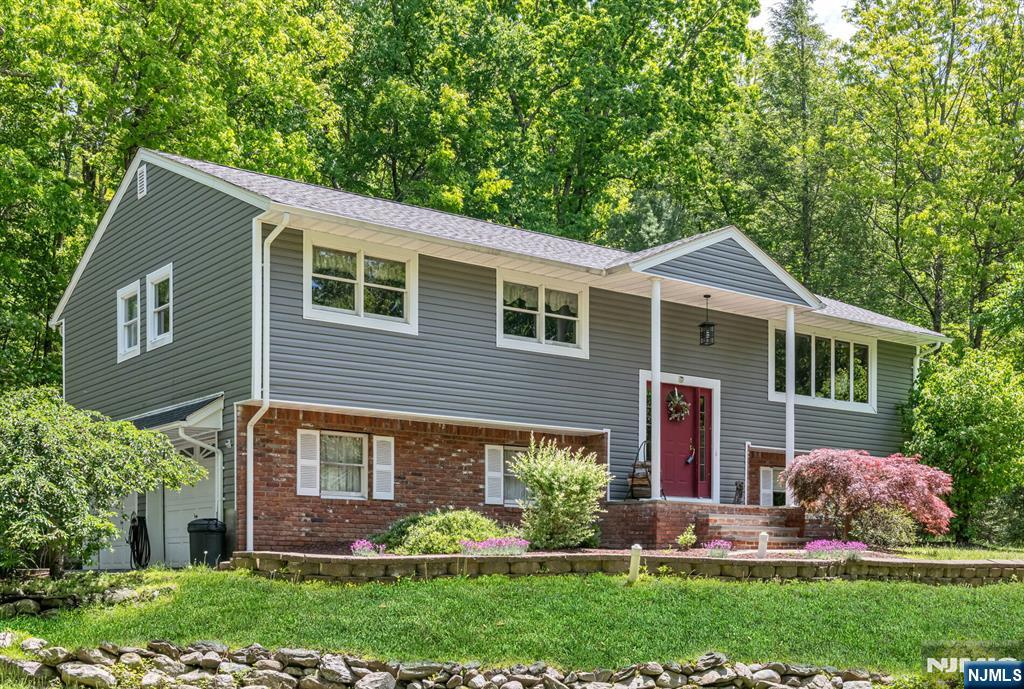Nestled in a beautiful natural setting, this charming bi-level home offers peace, privacy, and convenience. Located in a quiet residential neighborhood, the property is surrounded by scenic beauty and mature landscaping that create a truly tranquil atmosphere. Close to shopping, houses of worship, and everyday amenities, this home combines serene living with an ideal location. A wonderful opportunity to enjoy comfort, nature, and community all in one.