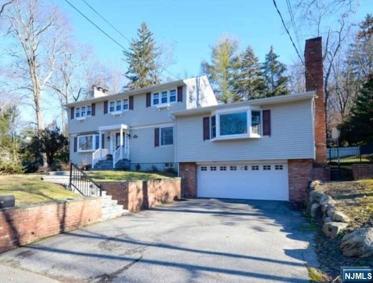Lovely Center Hall Colonial in Desirable Pines Lake Section home with seasonal lake views. Wonderful open floor plan. Abundance of natural light filtering thru enhancing this home with style and comfort. Great Room/Library with a rolling ladder, built ins plus a wood burning fireplace. Kitchen opens to huge room, Formal Living rm w/wood burning f/p, Formal Dining Rm. Full finished lower level with full bath & Gas Fireplace leading to oversized two car garage. Walk to Pines Lake Elementary School and the lake/beach on Balsam Rd! Pines Lake is a very desirable section in Wayne offering, swimming, boating, fishing and tennis plus numerous Clubs and activities for all ages! You will love coming home!!