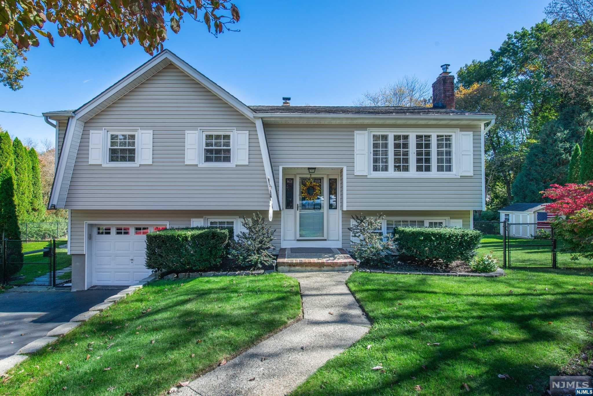 Welcome to your ideal home in Jefferson, NJ! This lovely 3-bedroom residence features an open floor plan with hardwood floors throughout. From the stunning living room filled with natural light, to the updated kitchen with stainless steel appliances and separate dining room this home is not to be missed! Each bedroom boasts ample living space with large closets. Master Bedroom offers a modern half bath. The full, finished basement has limitless potential for all your entertaining needs with a wood burning stove, walkout to the yard and garage access. With a generous piece of land, an inviting above-ground pool, and a spacious deck, you'll enjoy countless moments of relaxation and entertainment. Your dream home awaits - seize this opportunity today!