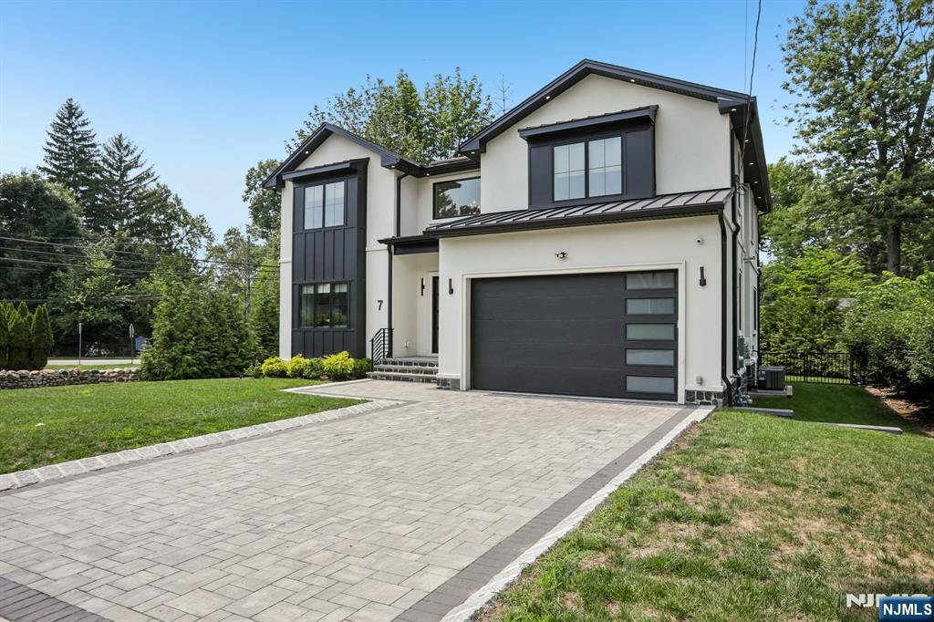 Built in 2023, this beautifully designed home in Cresskill offers 4 spacious bedrooms and 4.5 bathrooms, providing comfortable living spaces that accommodate a variety of lifestyles. A two-story foyer welcomes you into an open and airy floor plan, creating an ideal setting for both everyday living and entertaining. The home features 10-foot ceilings on the first floor, 9-foot ceilings on the second floor, a gas fireplace, and a smart lighting system that enhances its modern design. The thoughtfully designed kitchen combines style and functionality with an 8-foot quartz center island and flows seamlessly into the dining room, living room, and family room, making it a natural gathering place for family and guests. The lower level offers a media room, wine room, wet bar, and office space, providing flexible areas for work, recreation, and entertaining. Additional highlights include solar panels, adding both efficiency and convenience.