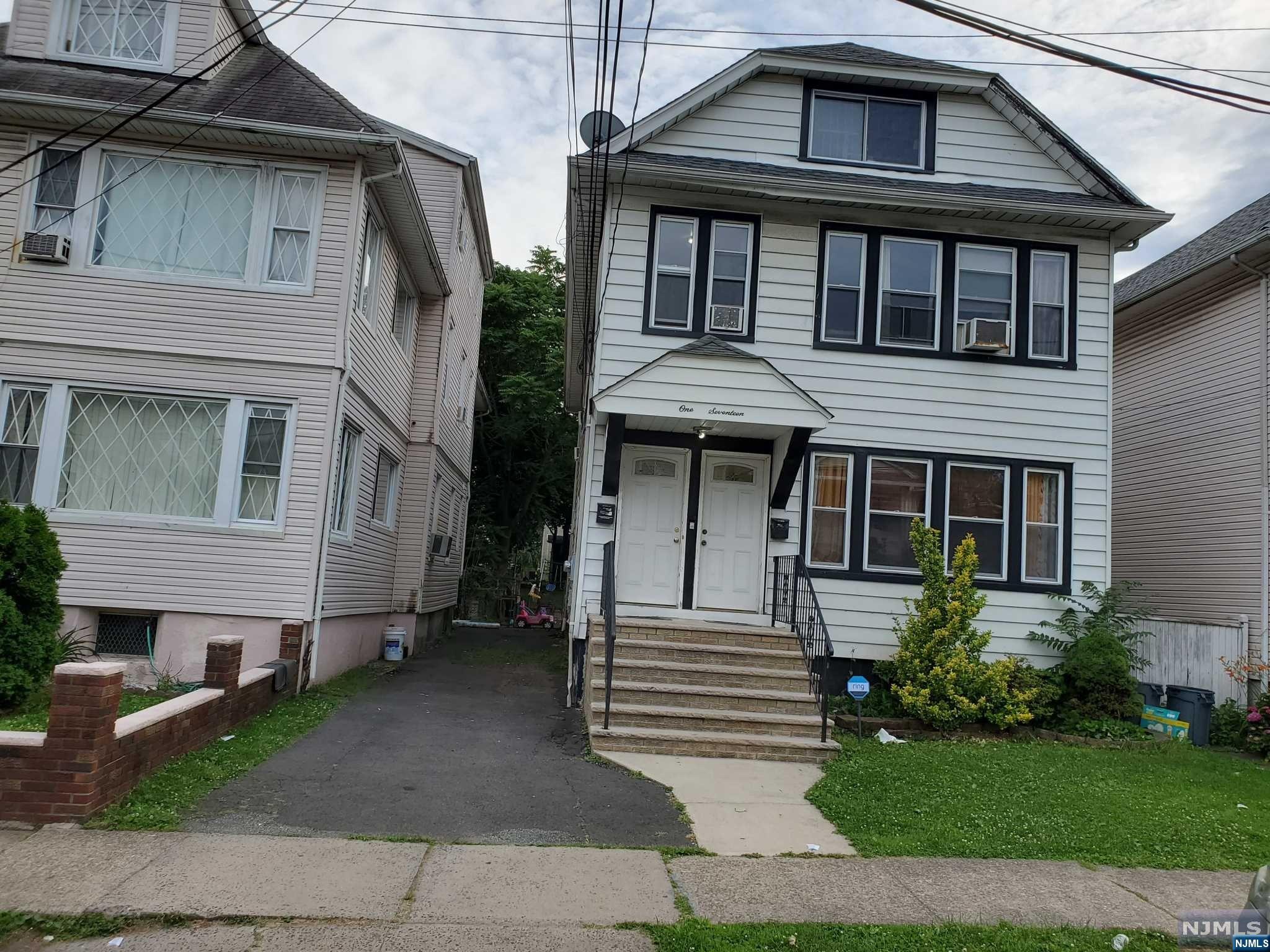 Oversized Two Family in the prime area of Passaic. House features four levels, an extra large yard with a bonus lot attached to the backyard leading to Park(243 Park Ave).