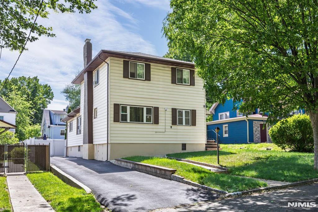 Welcome to this unique and beautifully maintained home, ideally located in a prime commuter location. This inviting residence features a spacious living room with a fireplace, formal dining room, and a newly renovated kitchen. The first floor offers two bedrooms and a full bath, while the second floor features two generously sized bedrooms, an additional full bath, and a bonus room ideal for a home office. Both the first and second floors have been upgraded with beautiful prefinished hardwood floors. The fully finished basement includes a half bath, providing additional recreational space. Outside, youâ€™ll appreciate the recently redone driveway and the pride of ownership evident throughout the well-maintained property. Conveniently located near parks, shopping, houses of worship, NYC transportation, and major highways, this home offers comfort, space, and exceptional convenience.