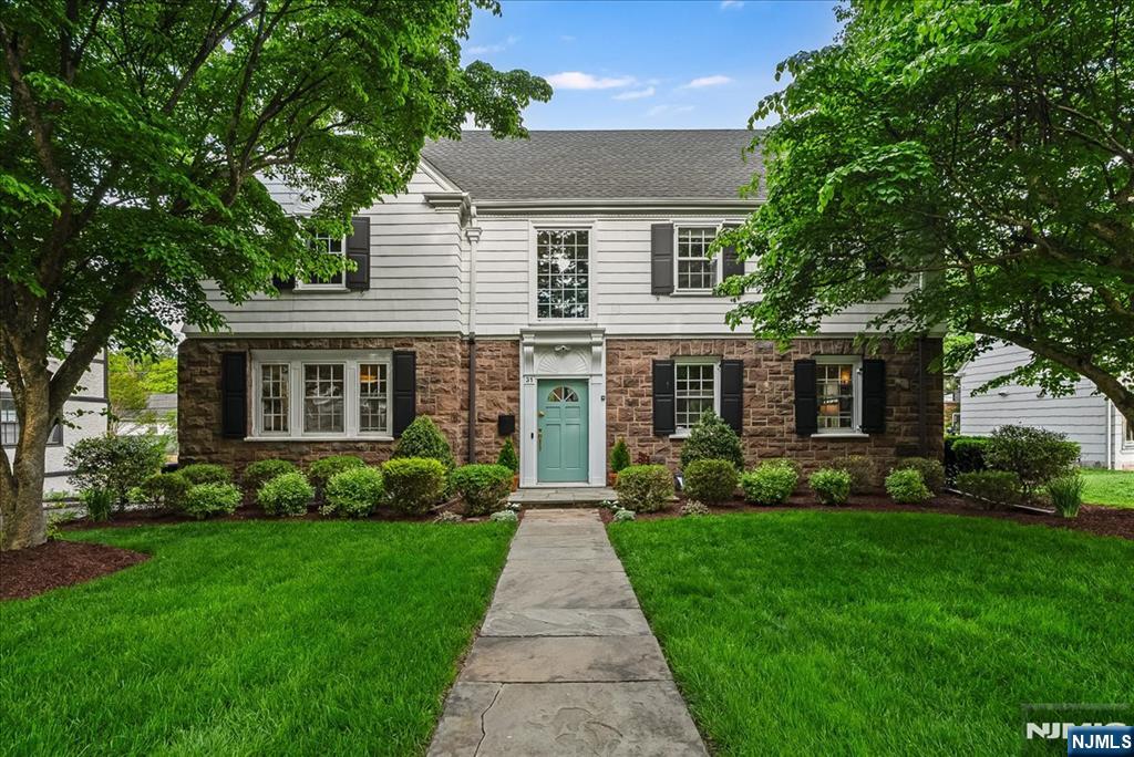 Located in one of Montclair's most cherished neighborhoods, this enchanting Center Hall offers the character, & livability today's buyers are searching for. Graceful architecture defines the home, w/soaring ceilings, pristine wood floors, & refined millwork throughout. Paneled wainscoting and beautiful arched openings introduce a quiet sophistication that carries from room to room. A welcoming foyer sets the tone, flanked by a generous LR & a paneled dining room made for gathering. The LR is anchored by a substantial WBF & opens to a sunlit den w/built-in bookshelves overlooking the backyard. The 1st FL is completed by a sleek updated kitchen w/Viking stove & Fridge, Bosch DW,& granite counters, breakfast room w/floor-to-ceiling windows, & updated powder. Upstairs, a sweeping staircase w/cathedral window leads to 2Fl, where 4 well-proportioned BRS inc a spacious primary suite & 3 large bedrooms w/main BTH. The 3FL offers flexibility, w/2 BRs (or WFH offices), a full BTH, generous storage, & cedar closet. The BSMT is the perfect media room, & the attached garage adds everyday convenience. Positioned less than a mile to Uptown Montclair and NYC-direct trains, and nestled between Brookdale and Yantacaw Parks, the location offers effortless access to trails, tennis, playgrounds, and open green space. Recent updates including a new roof (2024) and central air ensure comfort. A home with presence, warmth, and lasting appeal this is the one buyers wait for.